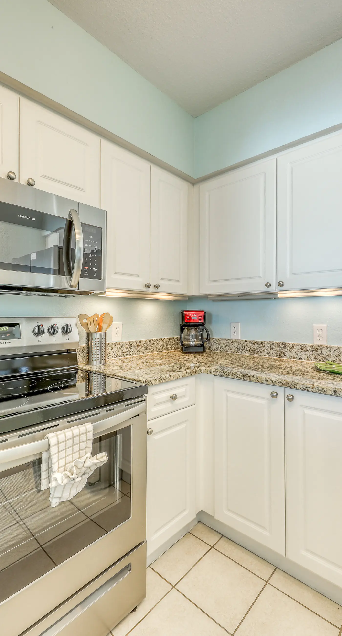 Light-filled beachfront condo with shared pool, hot tub & beach access