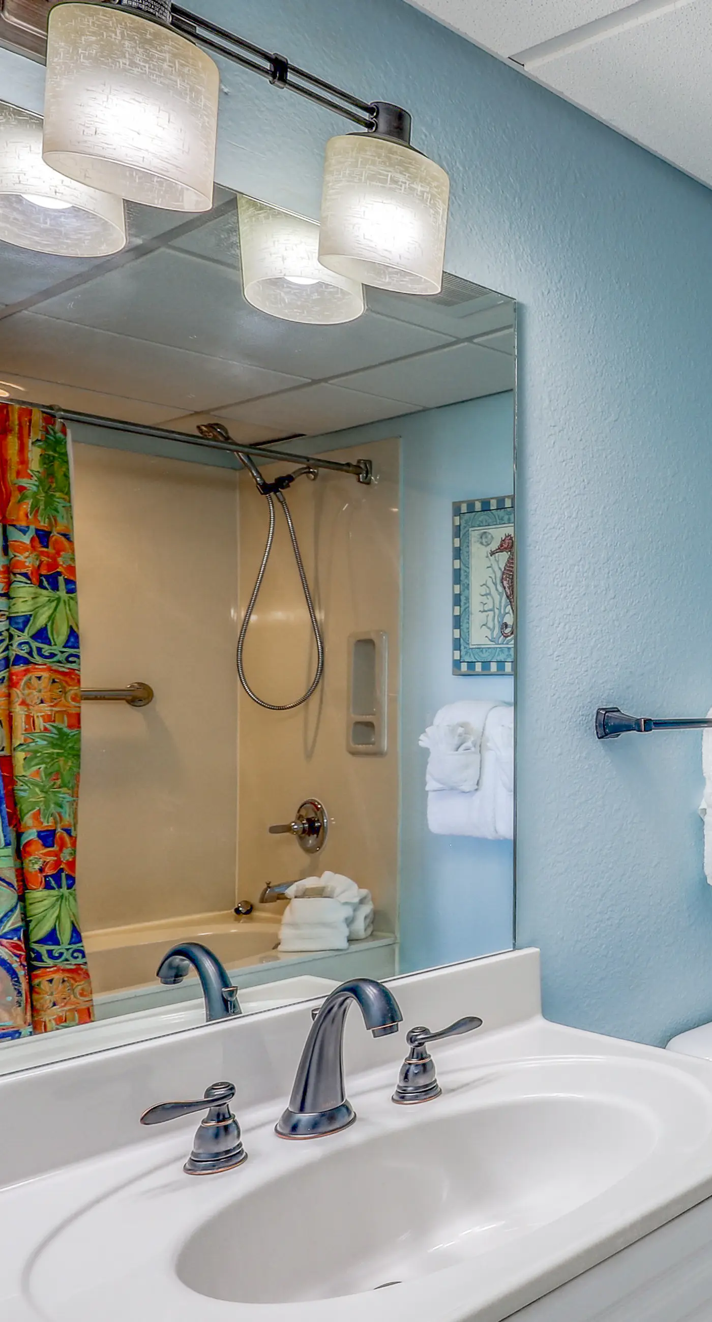 Light-filled beachfront condo with shared pool, hot tub & beach access