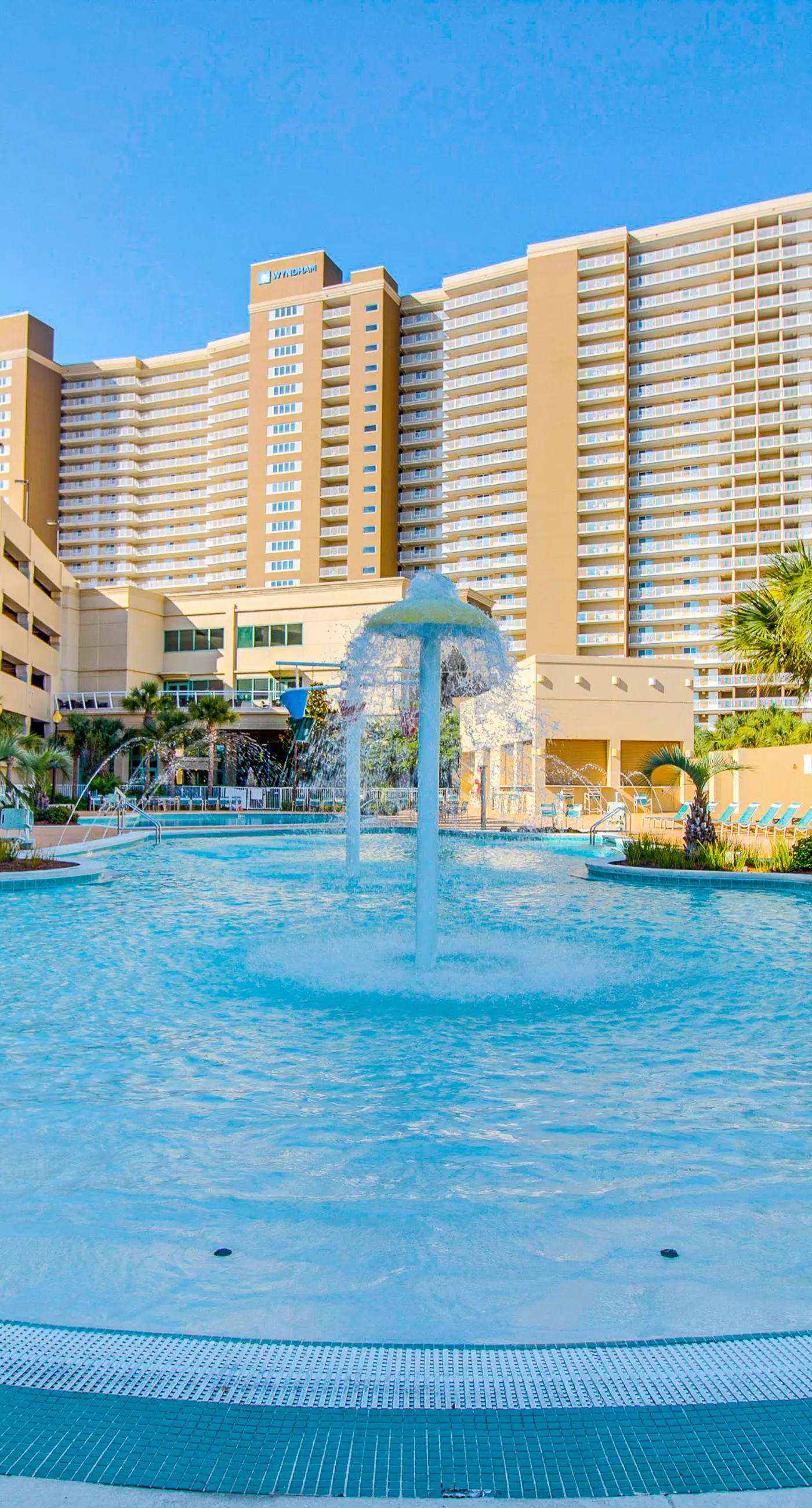 Light-filled beachfront condo with shared pool, hot tub & beach access