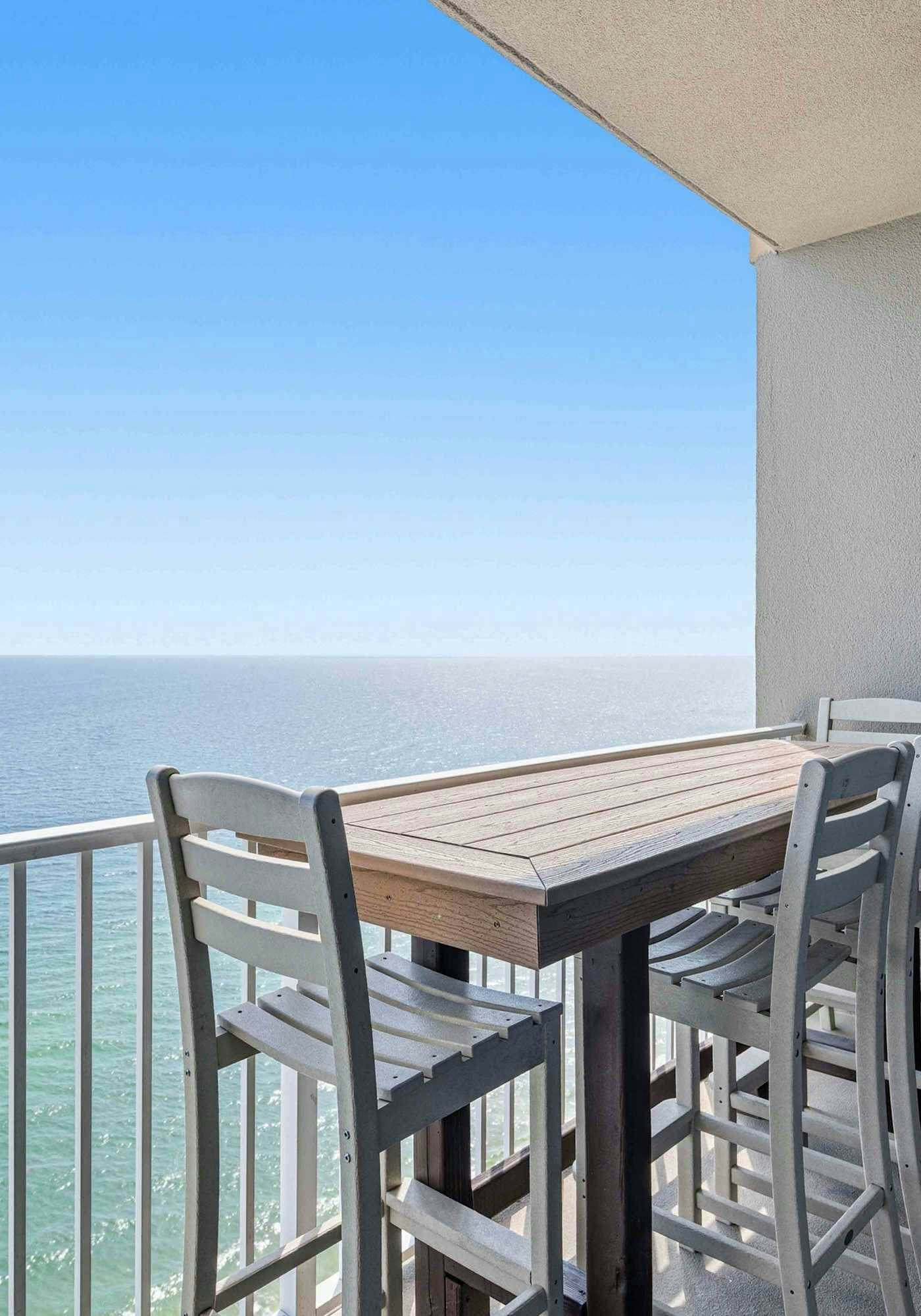 Waterfront condo with furnished balcony, hot tub, pools & gym
