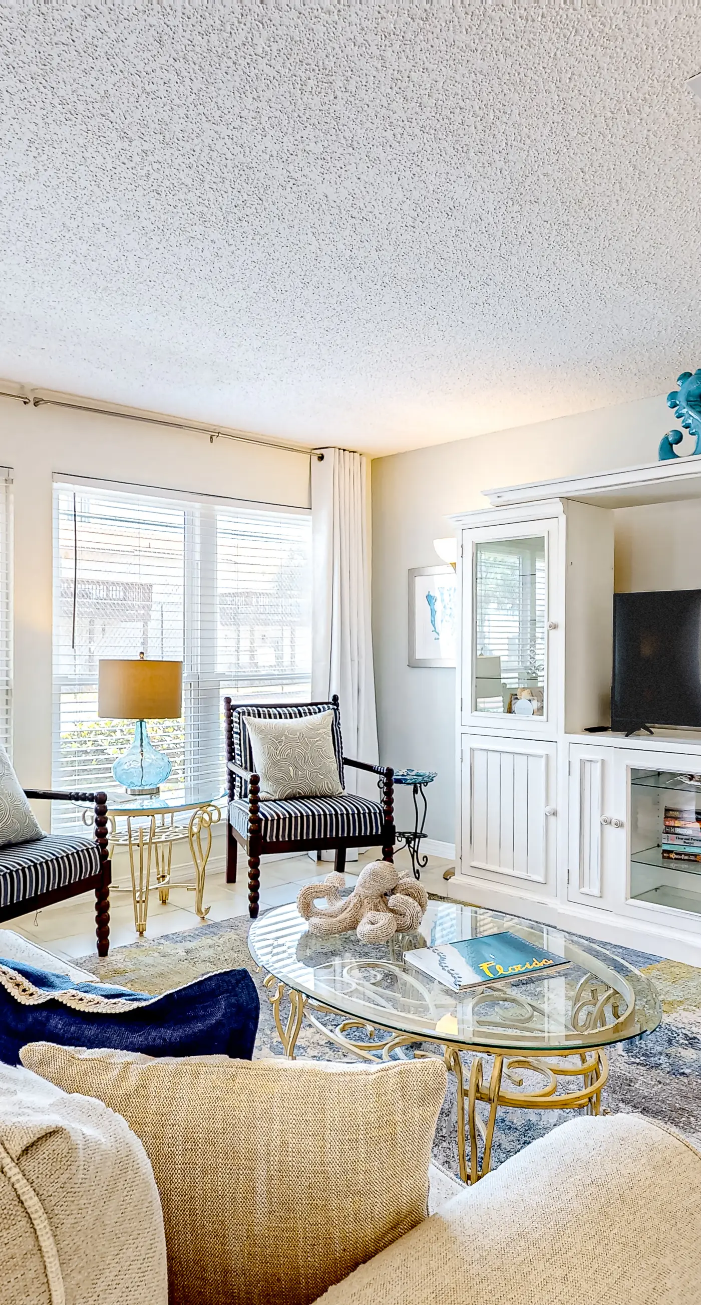 Inviting condo near the beach with patio, tennis, pool, & W&D