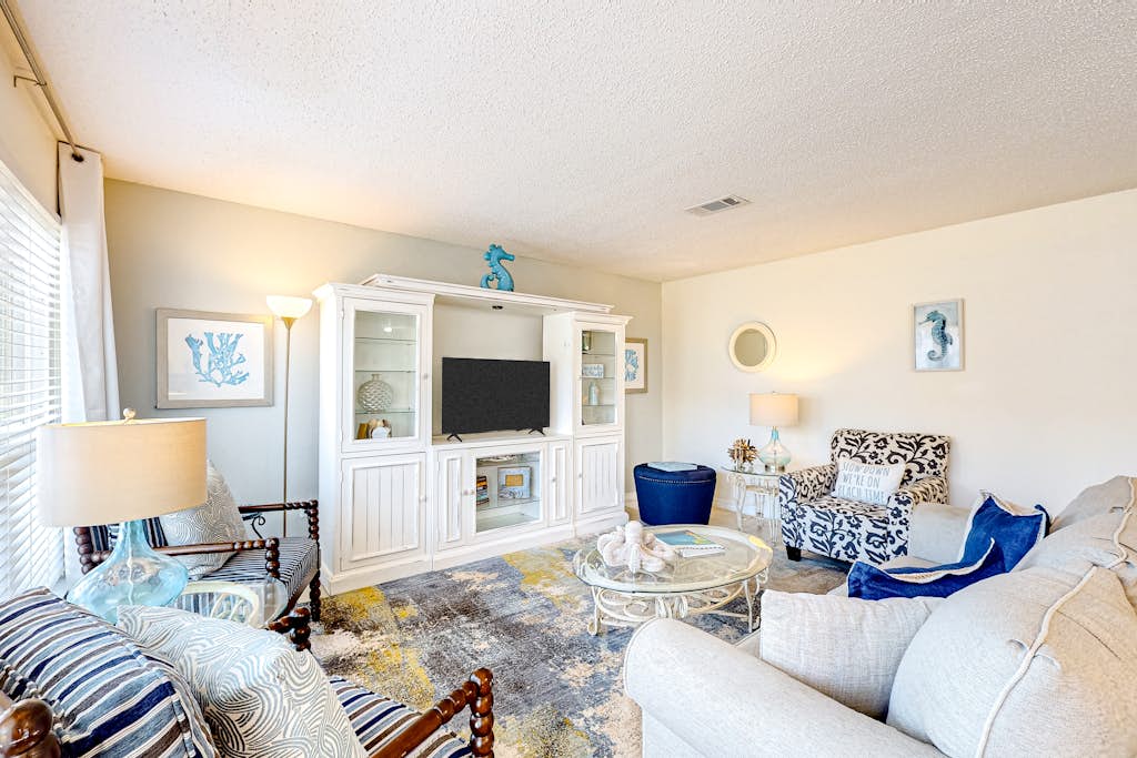 Inviting condo near the beach with patio, tennis, pool, & W/D