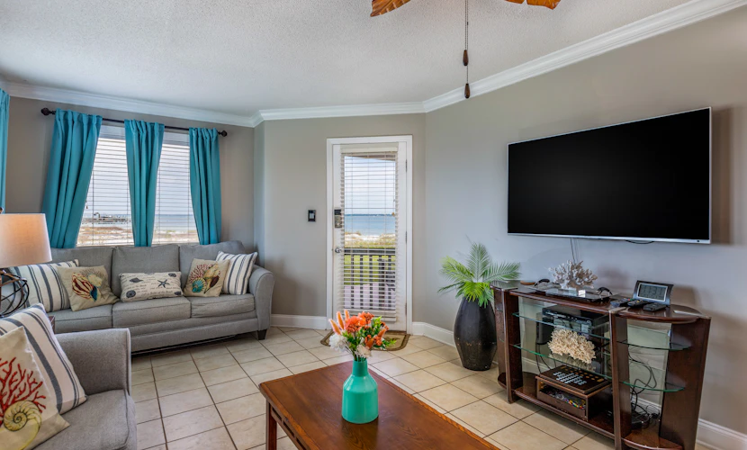 Condo with private balcony, pool, grills, central AC, & W/D