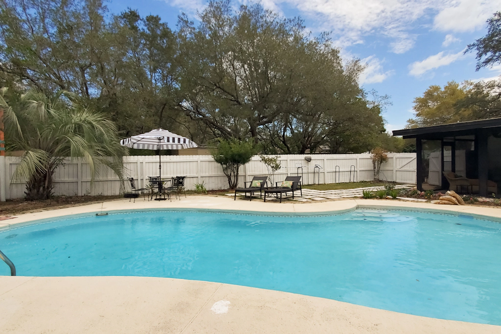 Updated dog-friendly home with private outdoor pool, patio, fireplace, W/D, AC