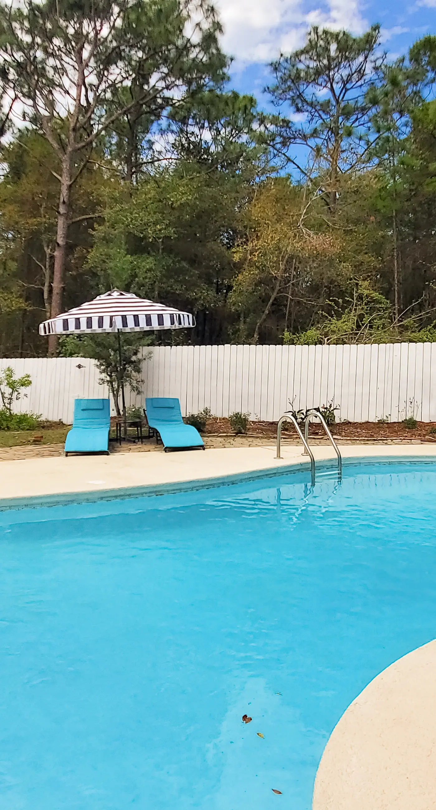 Updated dog-friendly home with private outdoor pool, patio, fireplace, W/D, AC