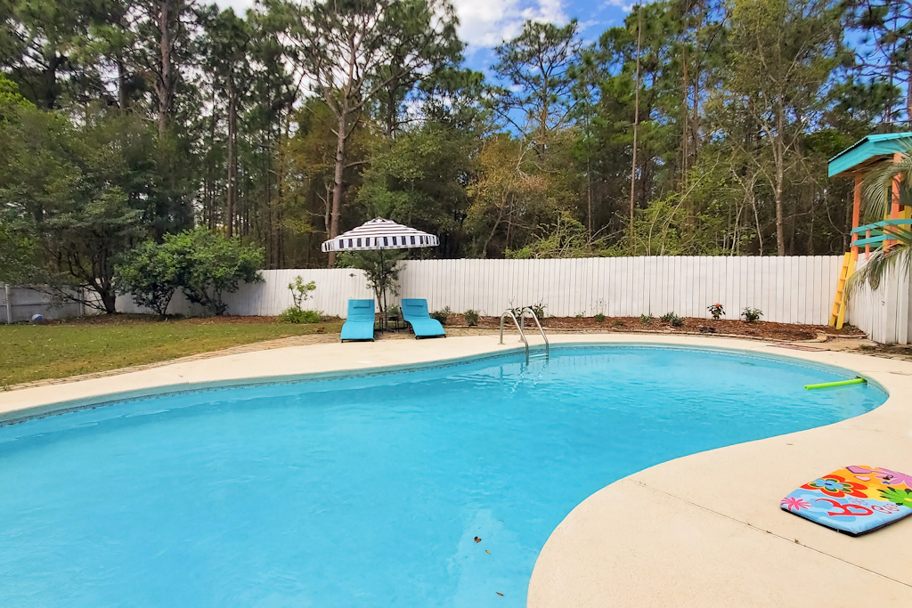 Updated dog-friendly home with private outdoor pool, patio, fireplace, W&D, AC