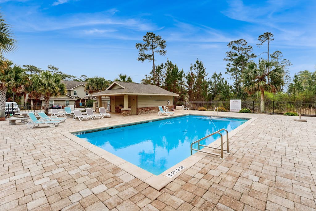 Inviting, two-story home with furnished patio, washer/dryer, & pool access