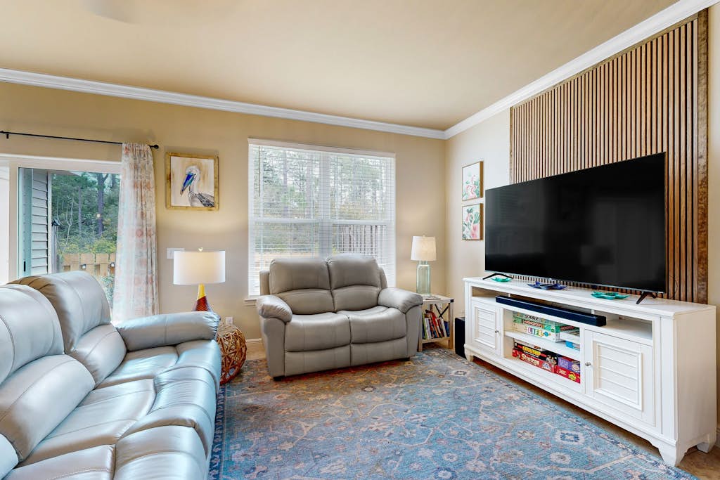 Inviting, two-story home with furnished patio, washer/dryer, & pool access