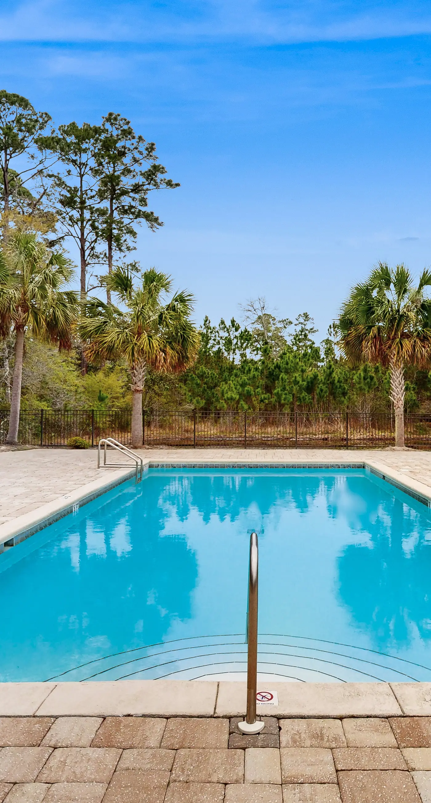 Inviting, two-story home with furnished patio, washer/dryer, & pool access