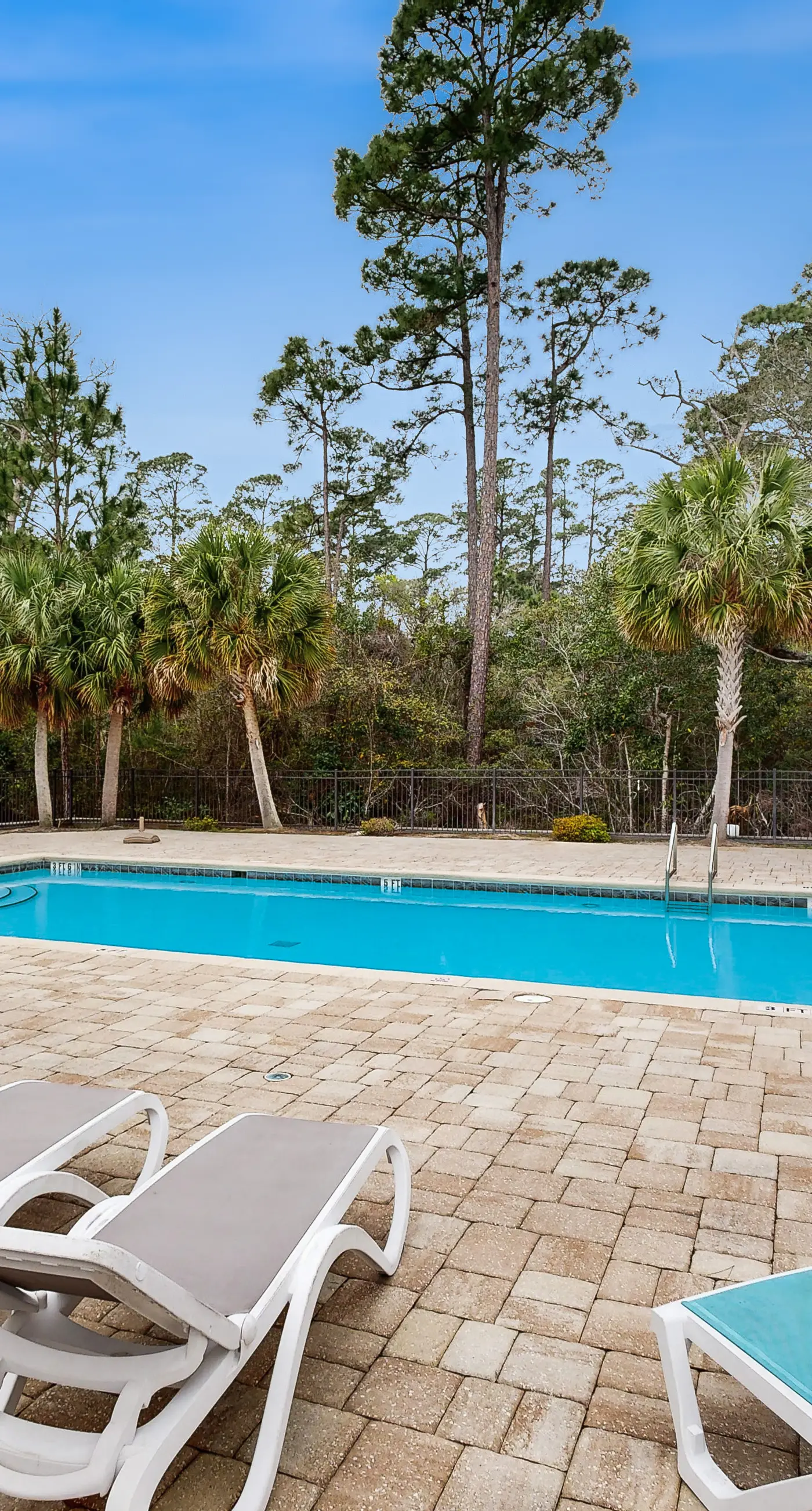 Inviting, two-story home with furnished patio, washer/dryer, & pool access