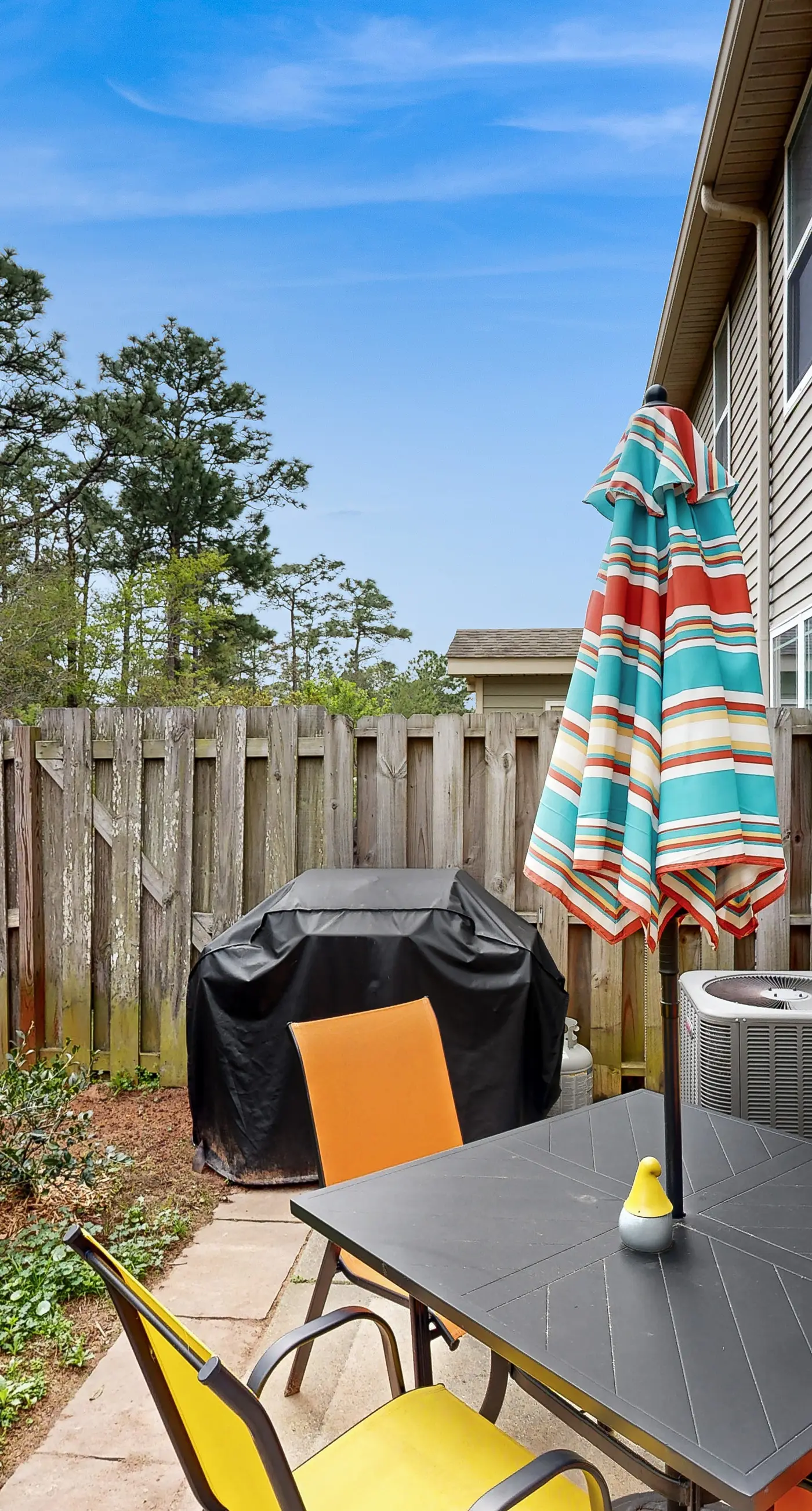 Inviting, two-story home with furnished patio, washer/dryer, & pool access