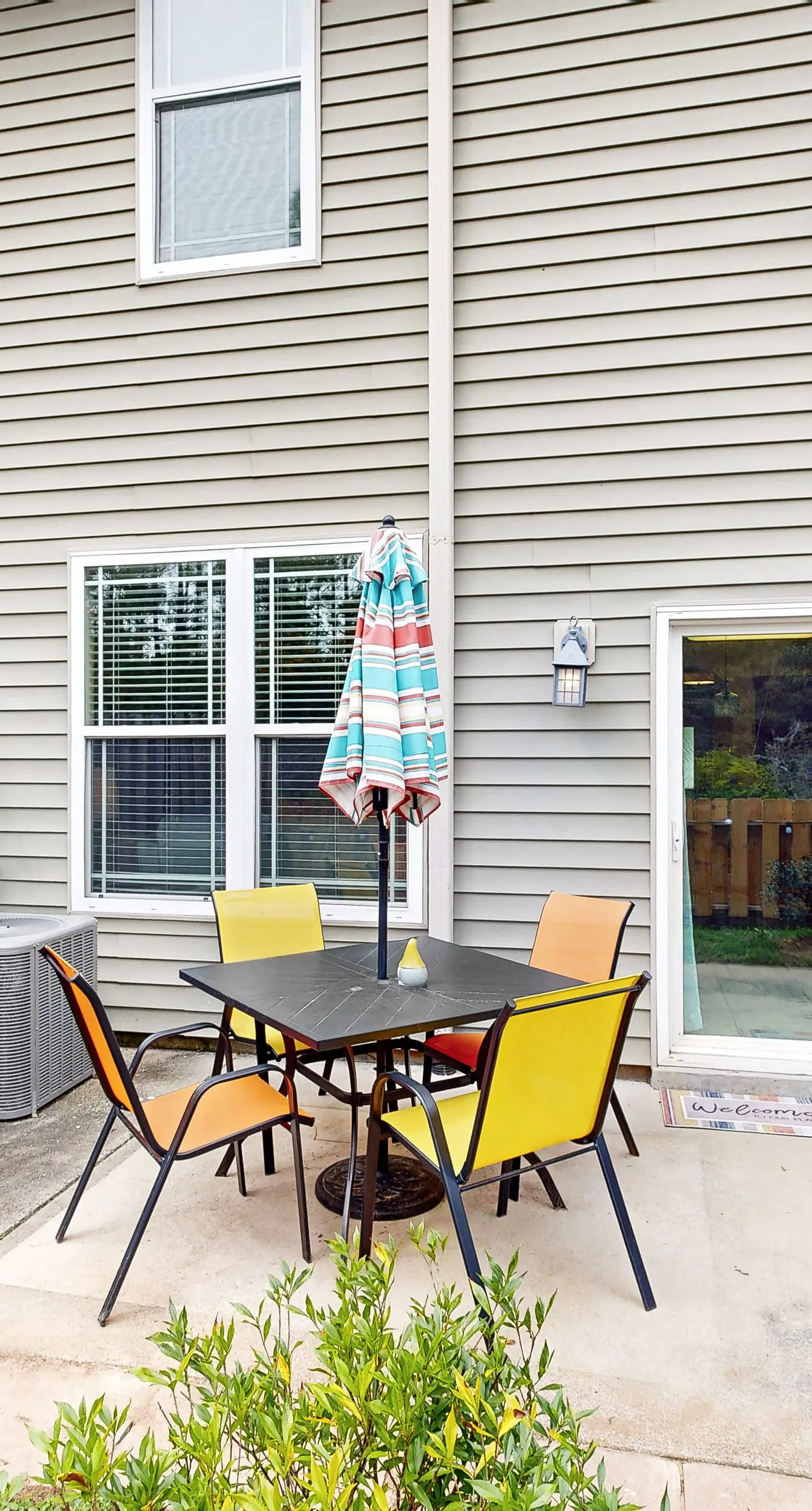 Inviting, two-story home with furnished patio, washer/dryer, & pool access