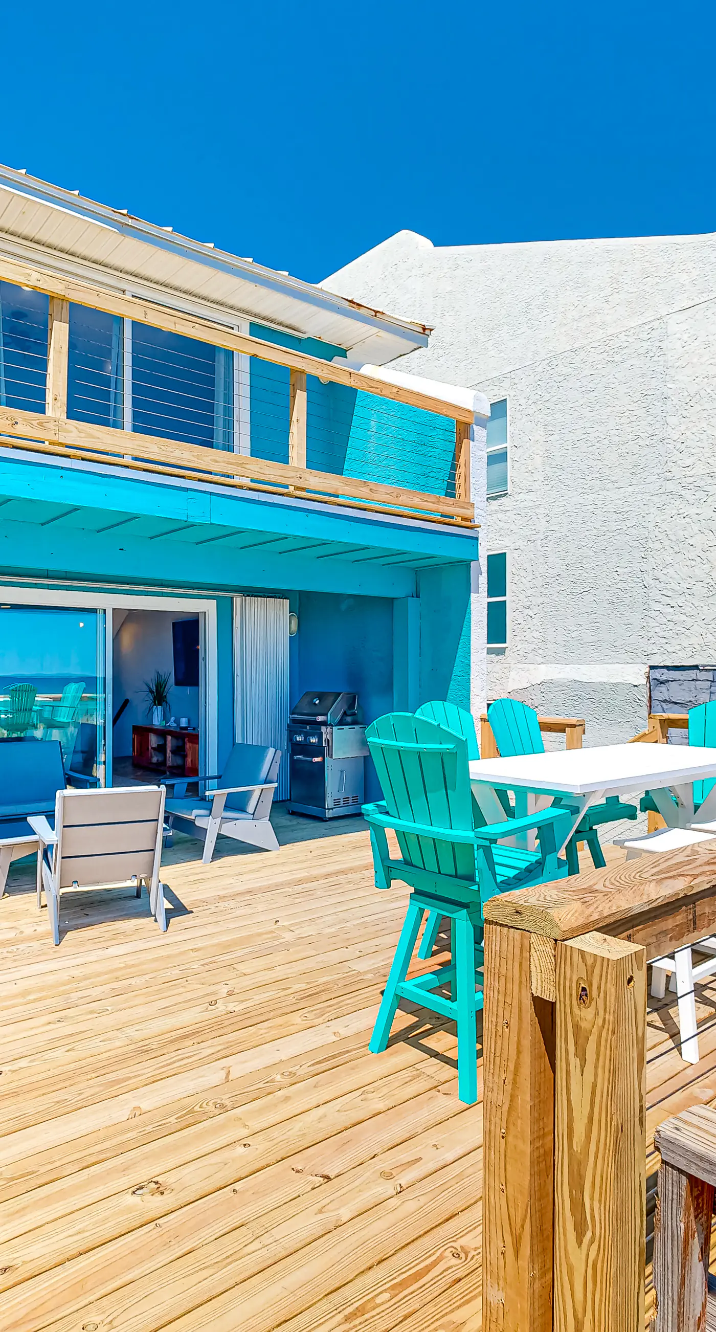 Three-Story Beachfront Gem with a Private Balcony, Ocean View, & Full Kitchen
