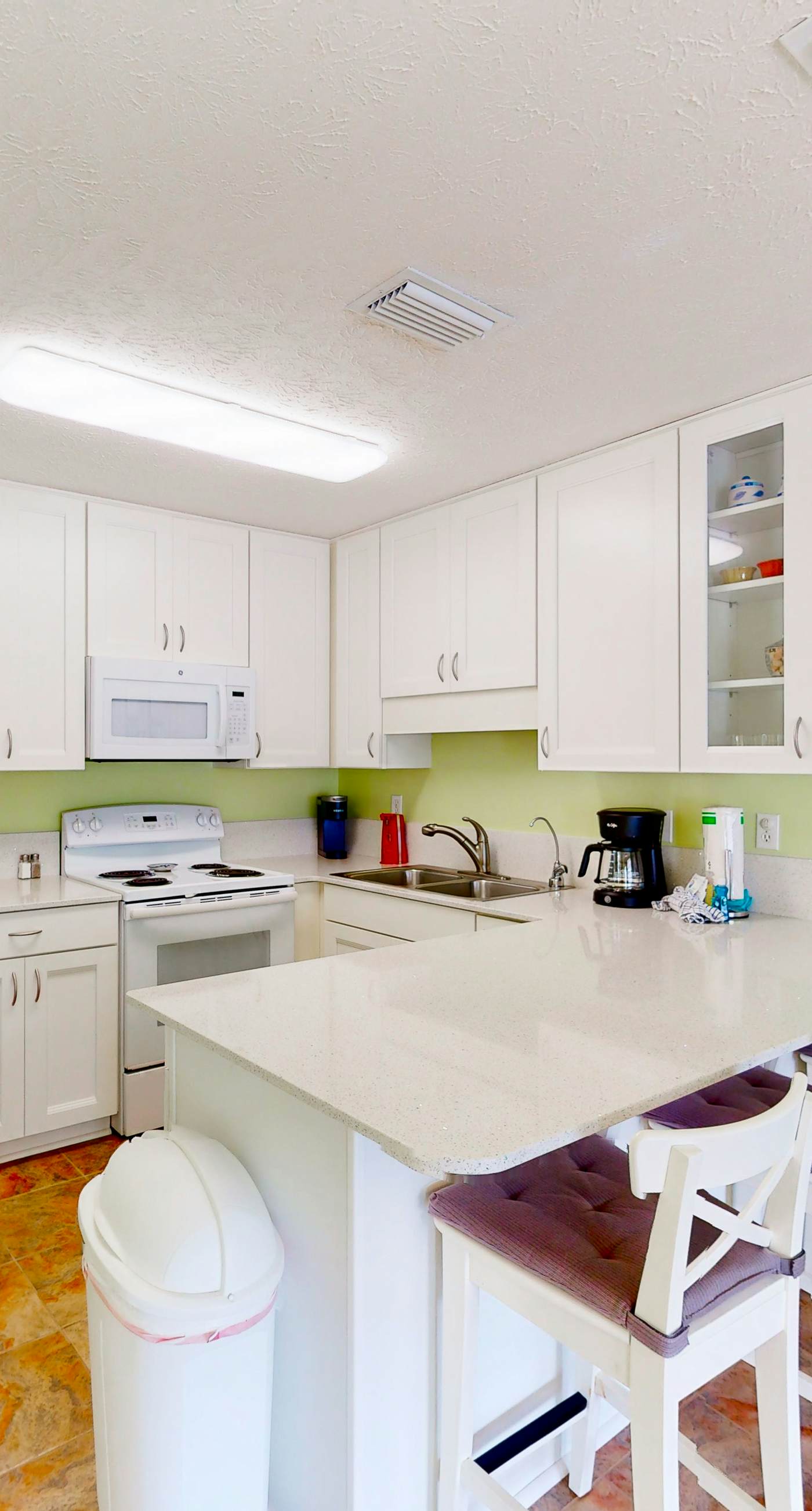 Ground-floor condo by the beach with on-site pool & 2 private patios