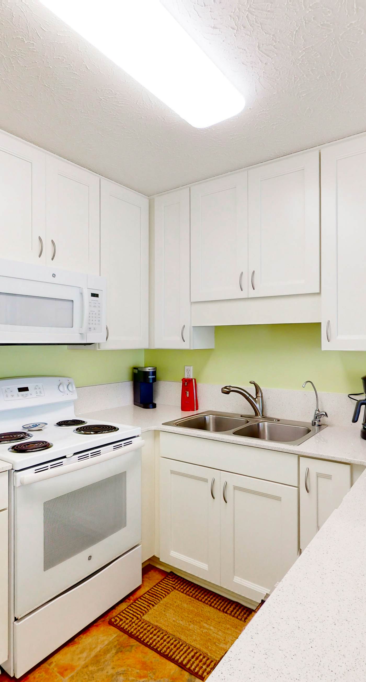 Ground-floor condo by the beach with on-site pool & 2 private patios