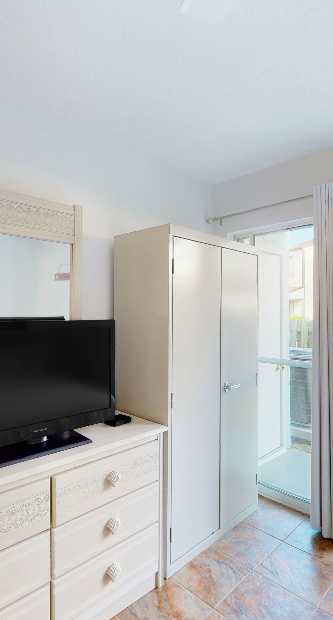 Ground-floor condo by the beach with on-site pool & 2 private patios