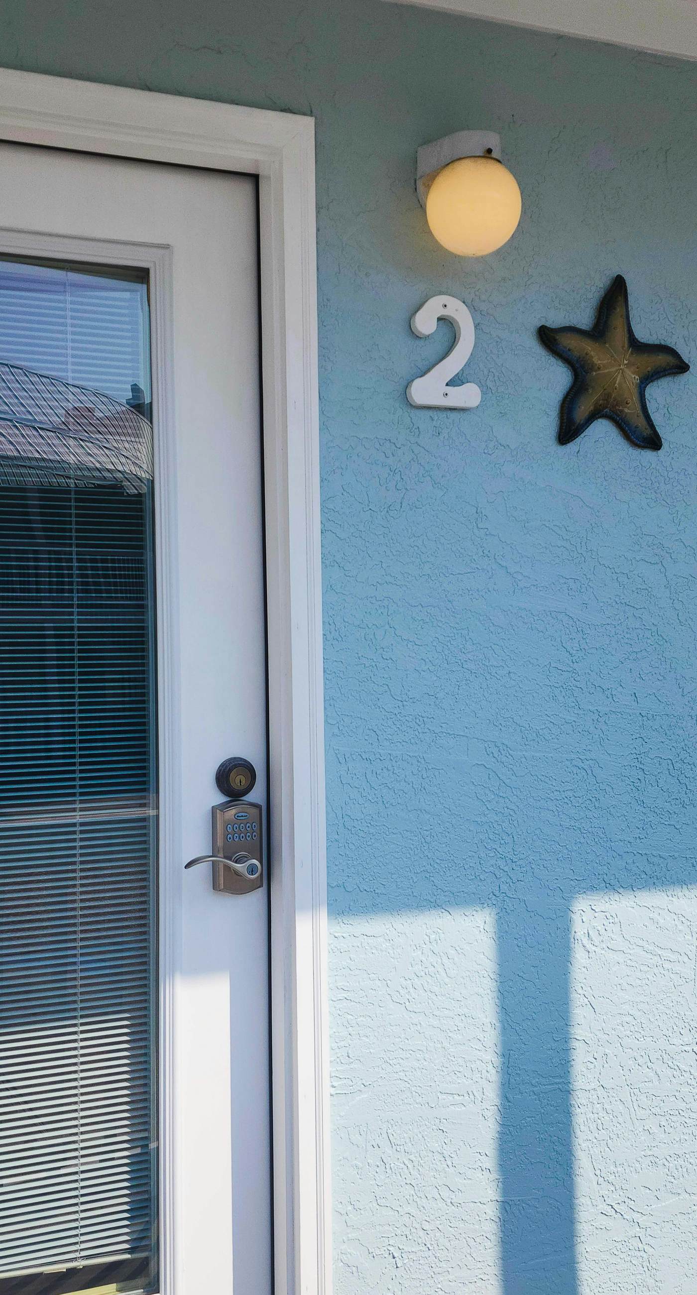 Ground-floor condo by the beach with on-site pool & 2 private patios