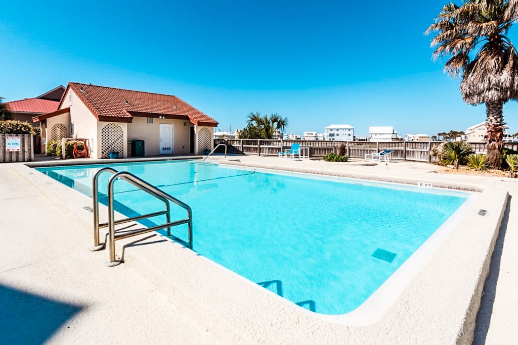 Beautiful condo with water-view, pool, balcony, central AC, & washer/dryer