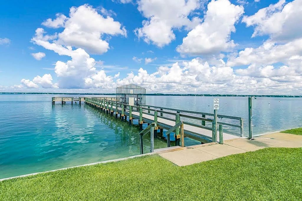 Cozy coastal condo with water view, pool, central A/C, & easy beach access