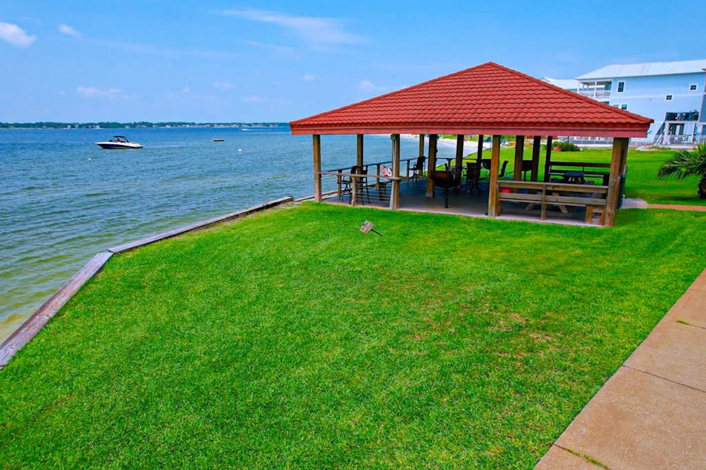 Cozy coastal condo with water view, pool, central A/C, & easy beach access