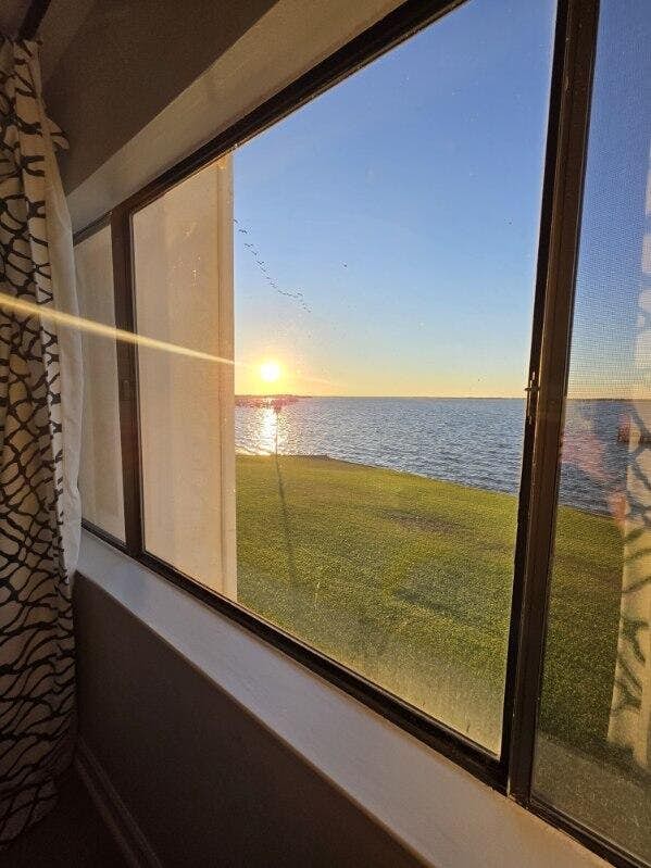 Cozy coastal condo with water view, pool, central A/C, & easy beach access