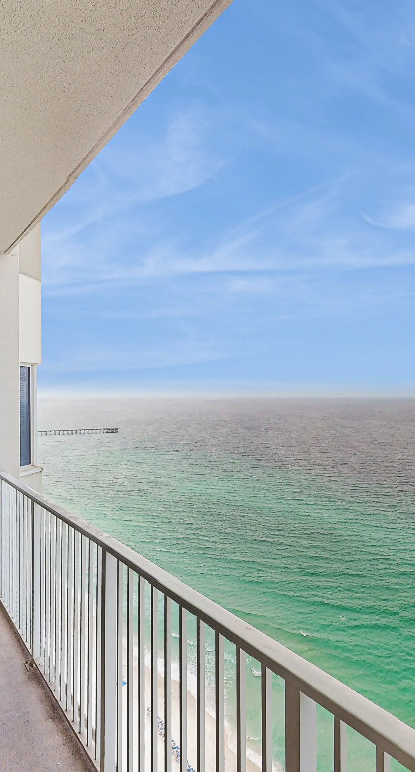 Escape to this waterfront condo w/ shared pools, a gym, & easy beach access