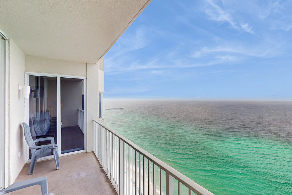 Escape to this waterfront condo w/ shared pools, a gym, & easy beach access