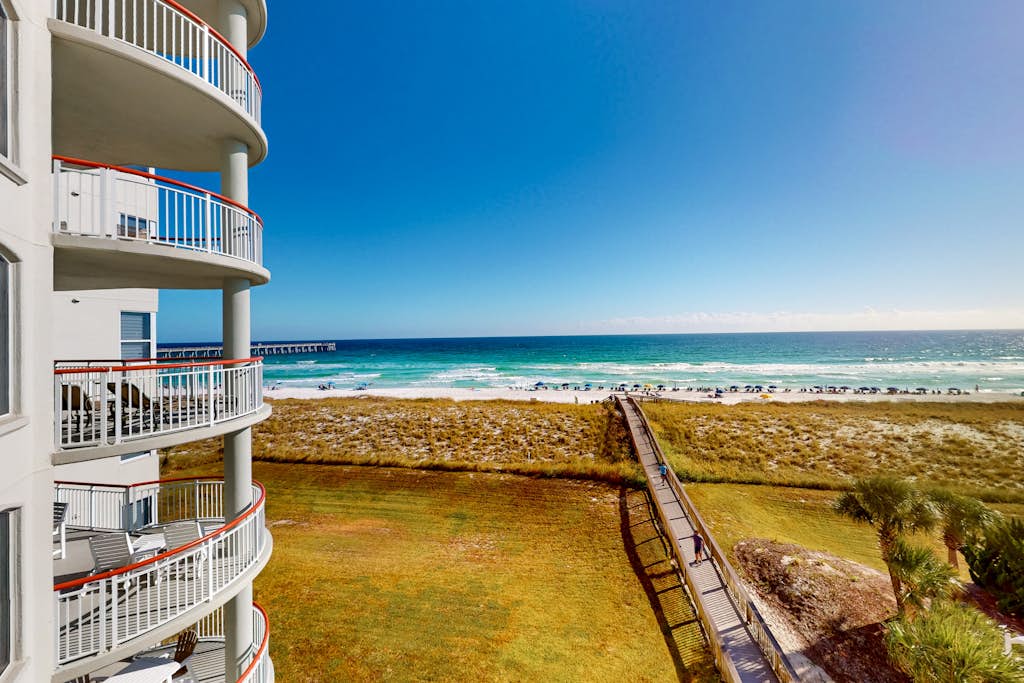 Beachfront condo with balcony, beach & pool views, pool, tennis, gym, W&D, & AC