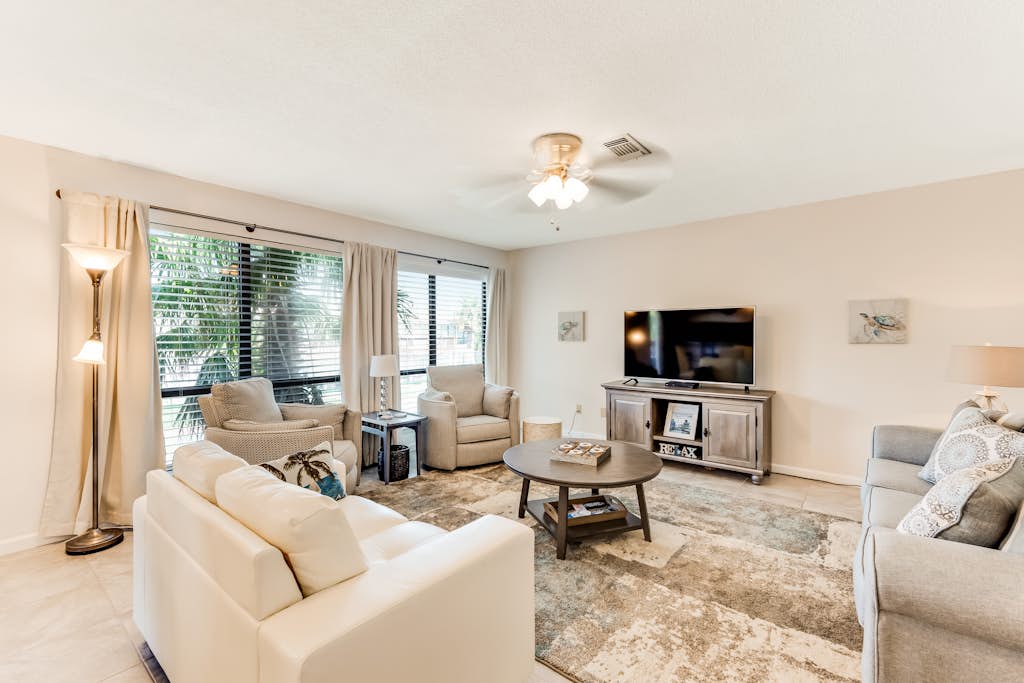 Second-floor condo with beach access, shared outdoor pool & tennis court!