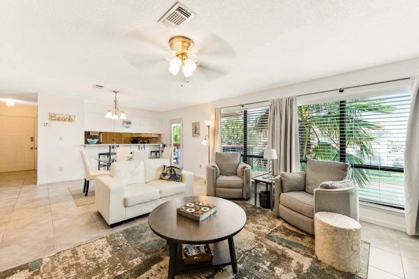 Second-floor condo with beach access, shared outdoor pool & tennis court!