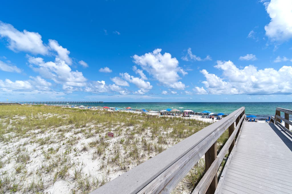 Beachfront townhome w/ on-site beach access, heated pool, patio, grill, AC, W/D