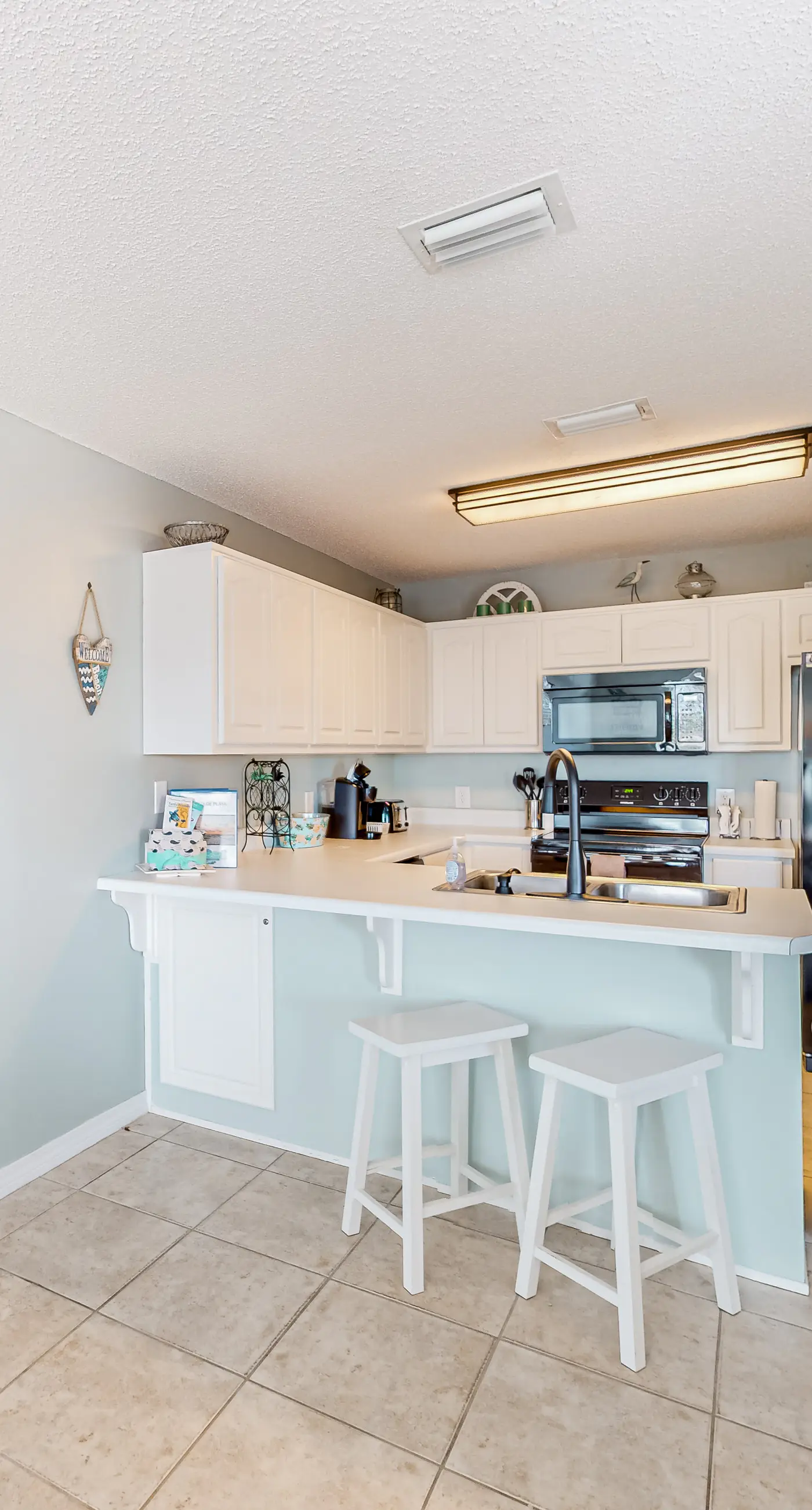 Sunny coastal condo with pool, balcony & sound view - walk to the beach