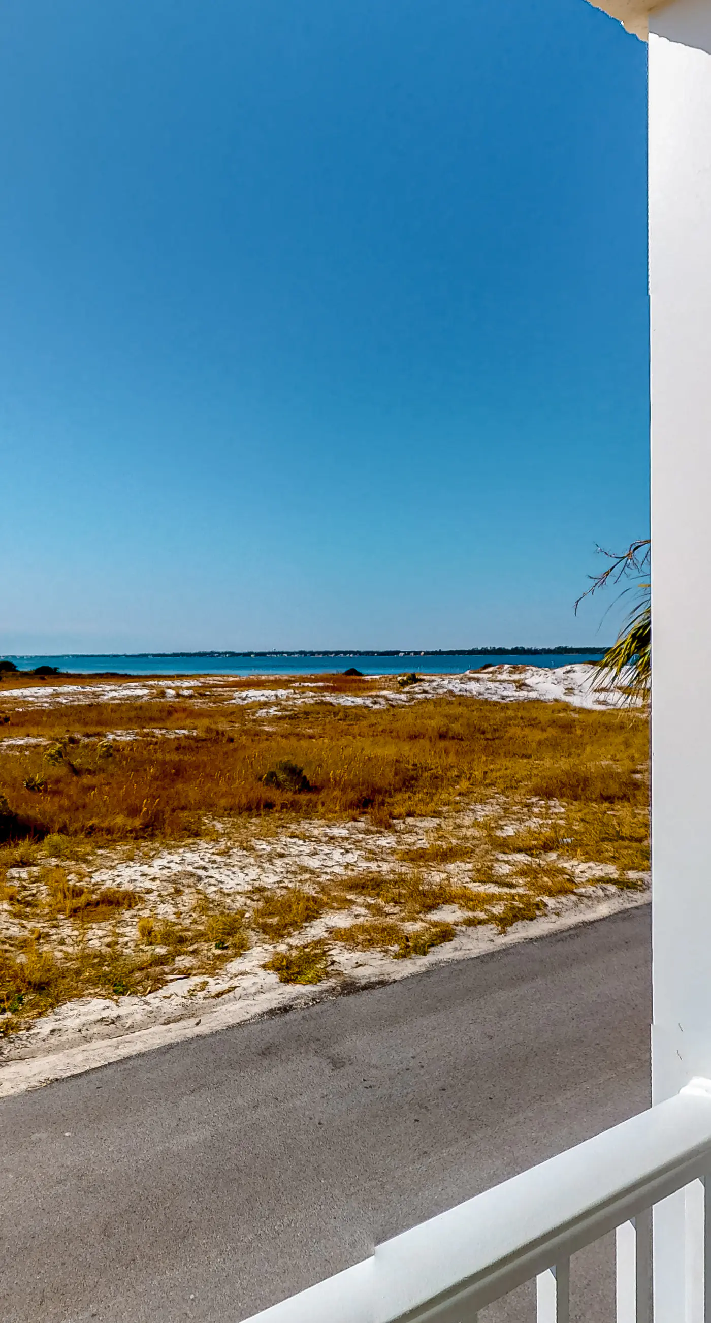 Sunny coastal condo with pool, balcony & sound view - walk to the beach