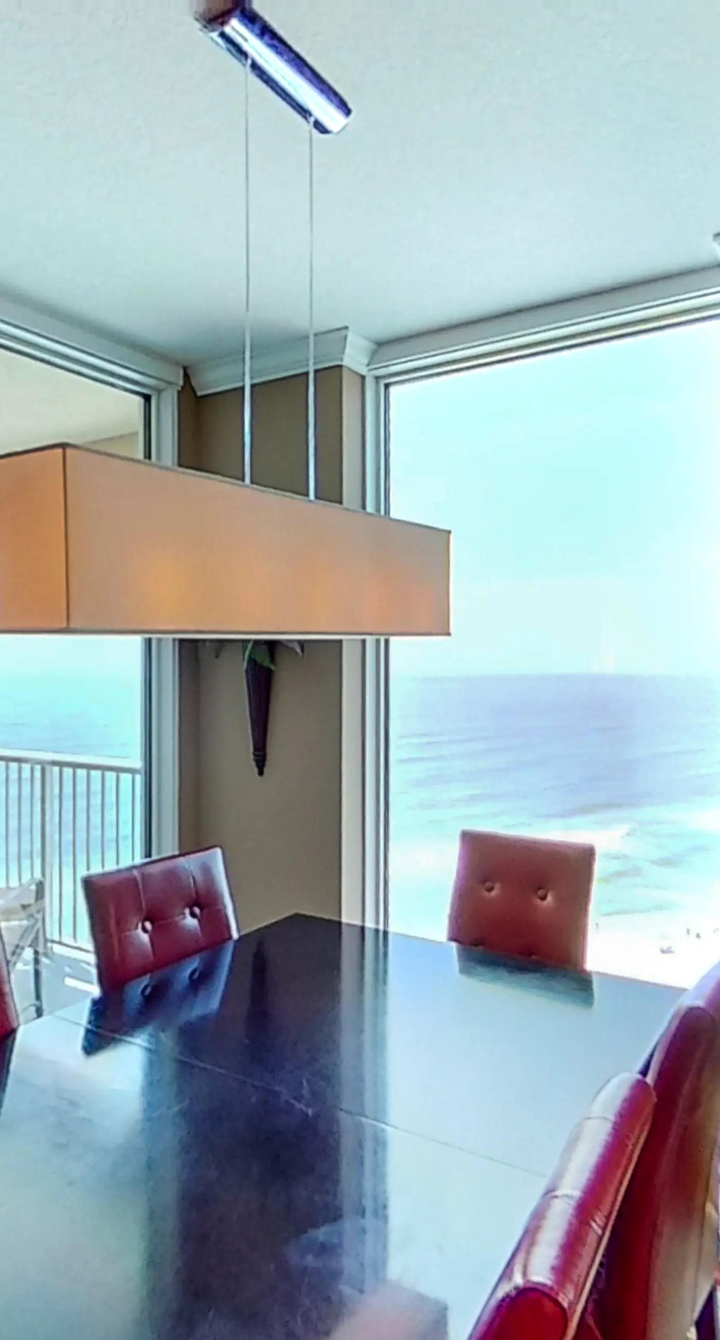 Stunning corner-condo with panoramic views, wraparound deck & beach access