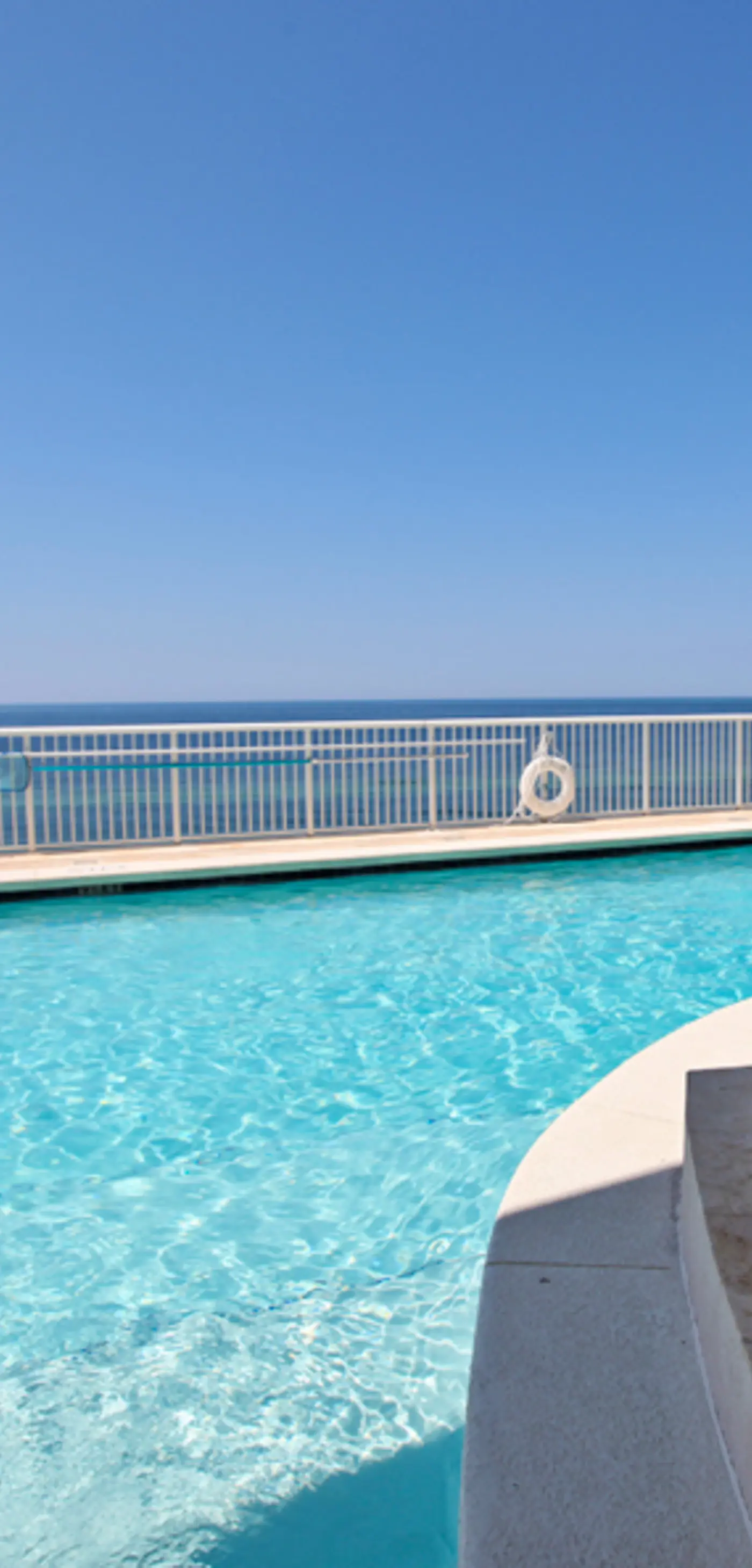 Gulf-facing condo with pool, scenic balcony, beach service & beach access