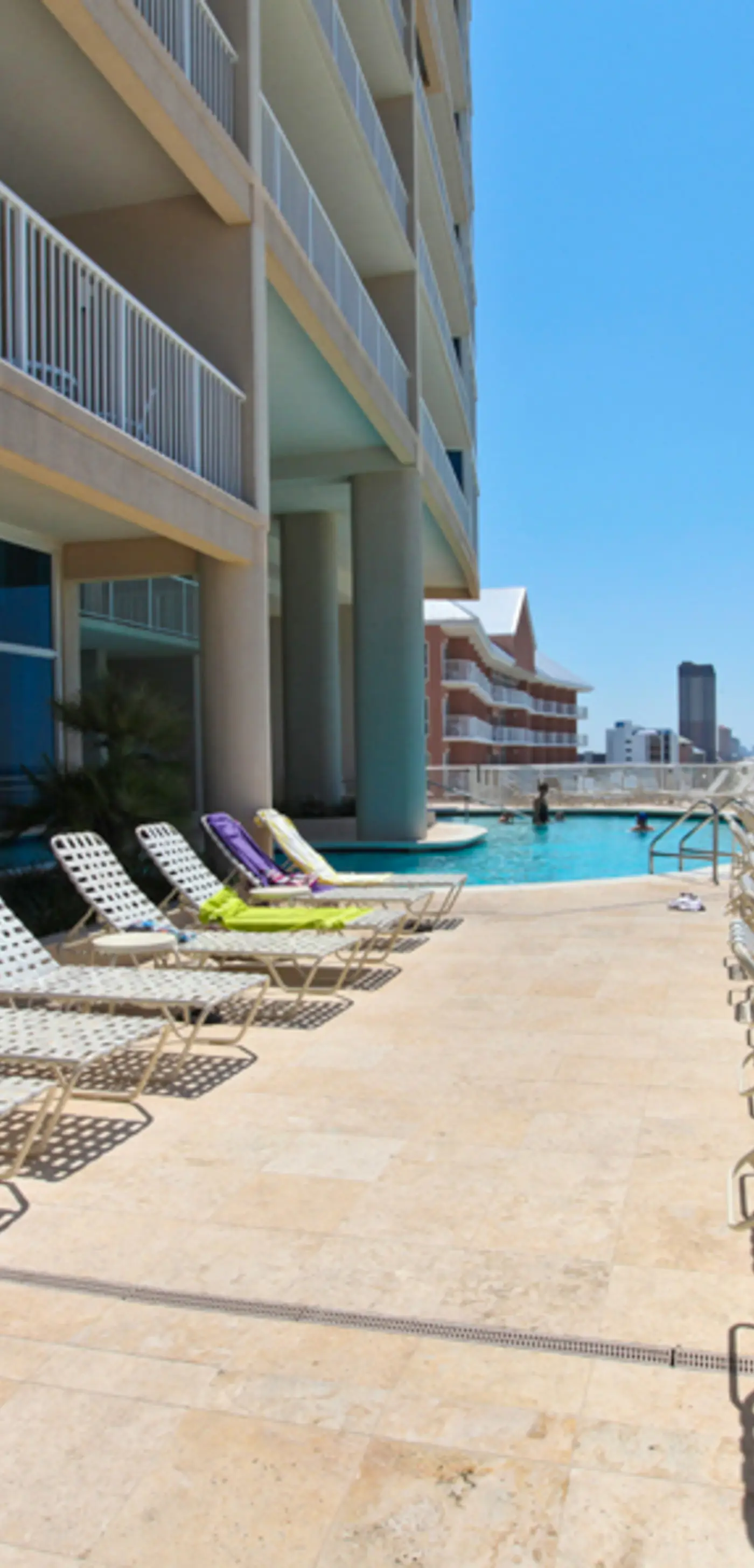 Gulf-facing condo with pool, scenic balcony, beach service & beach access