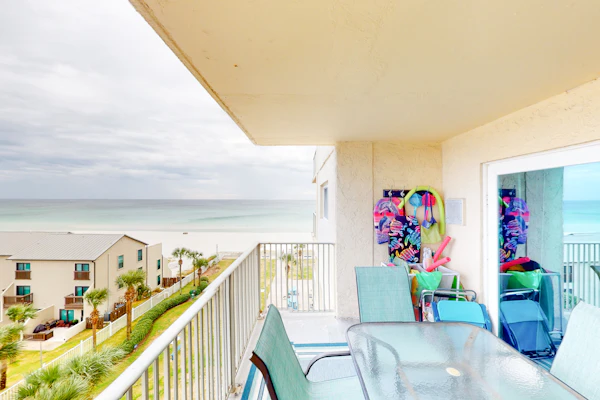 Beachfront condo with ocean-view balcony, pools, hot tub, gym, central AC, & W/D