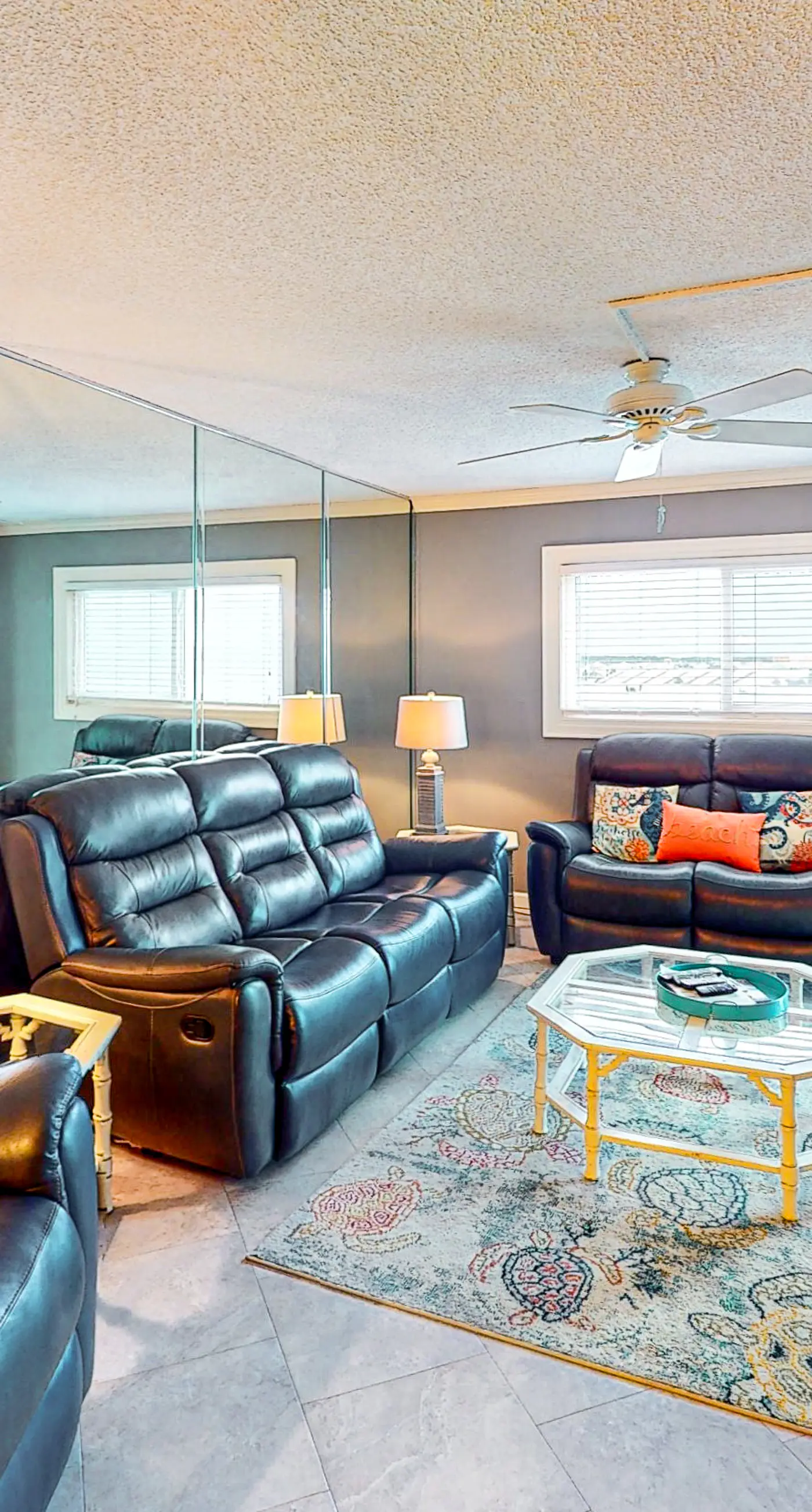 Beachfront condo with ocean-view balcony, pools, hot tub, gym, central AC, & W/D