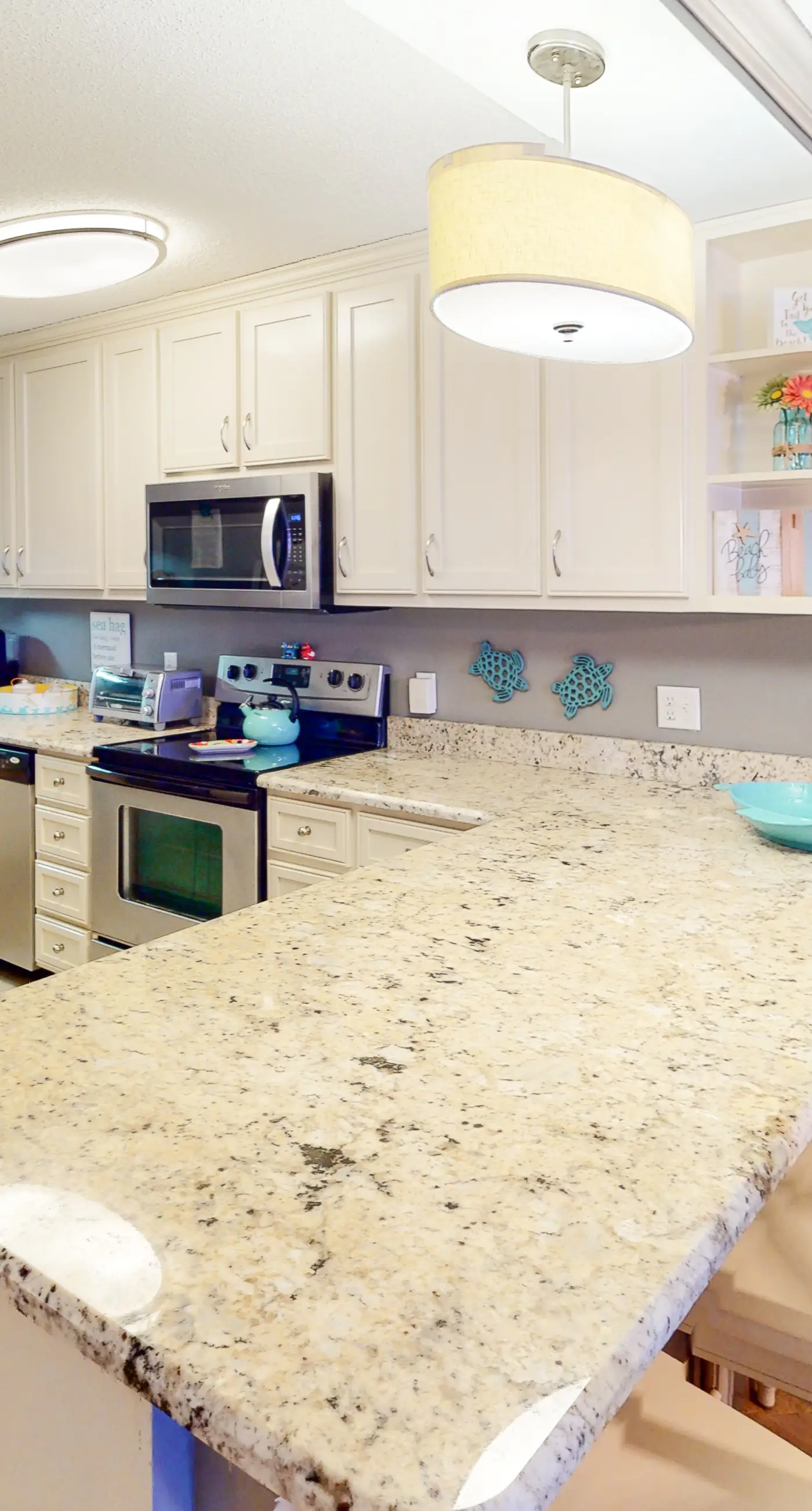 Beachfront condo with ocean-view balcony, pools, hot tub, gym, central AC, & W/D