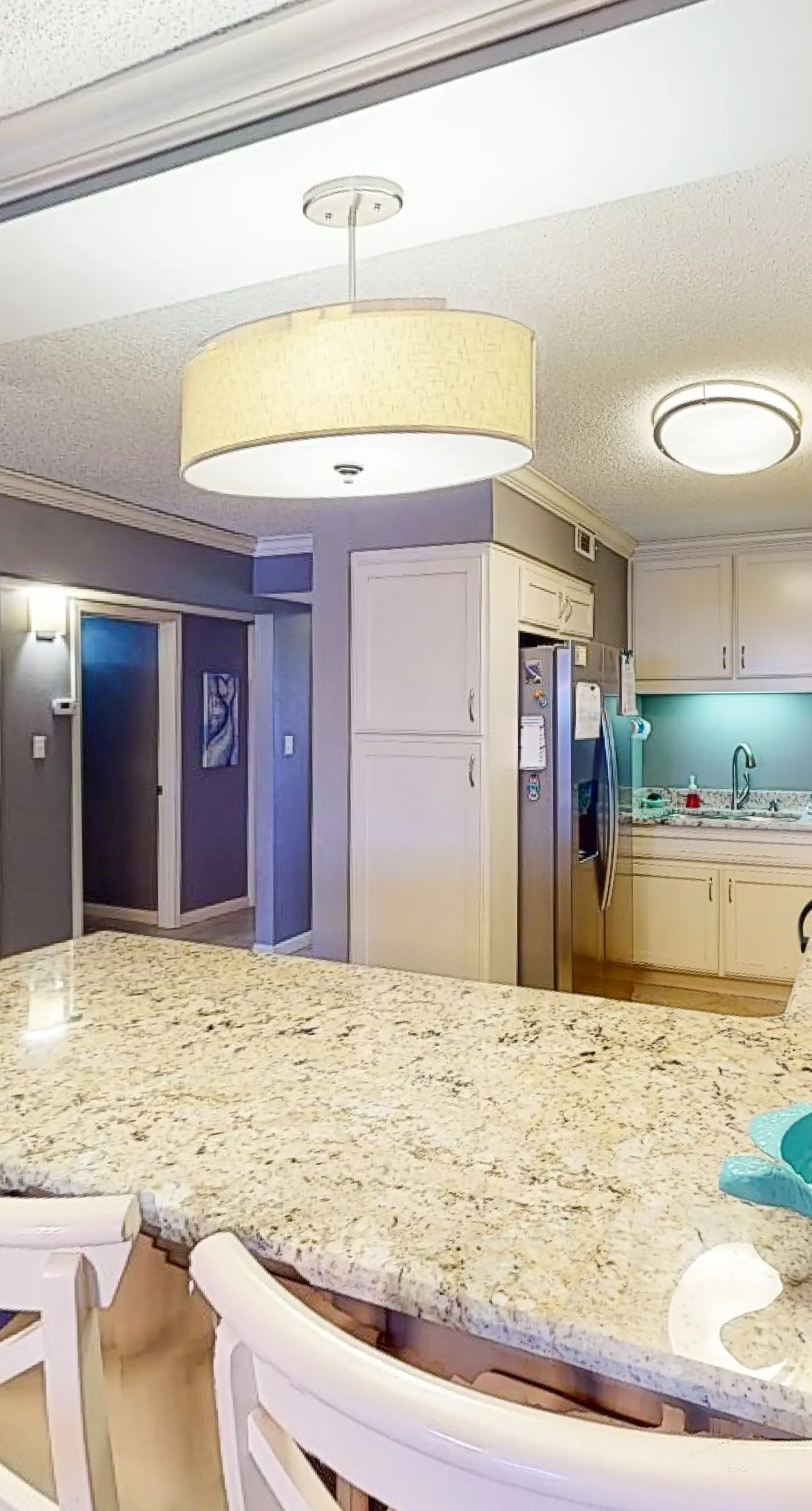 Beachfront condo with ocean-view balcony, pools, hot tub, gym, central AC, & W/D