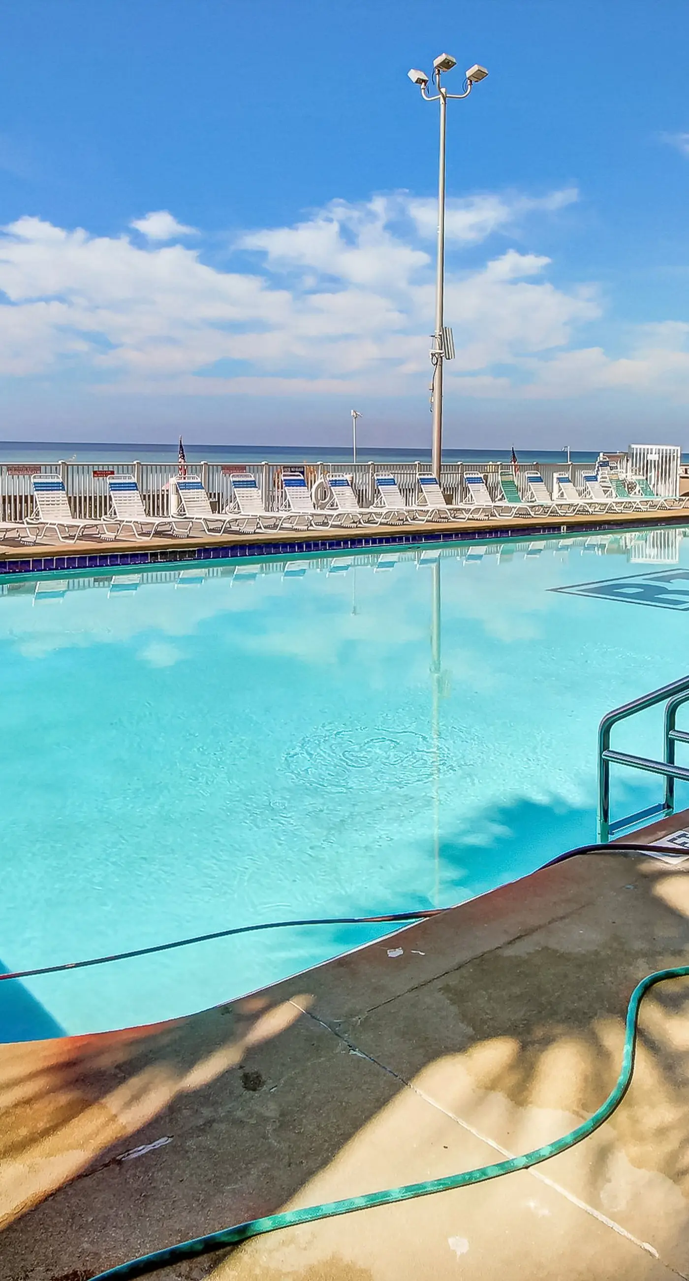 Stunning beachfront condo w/ beach access, shared pool, & private balcony