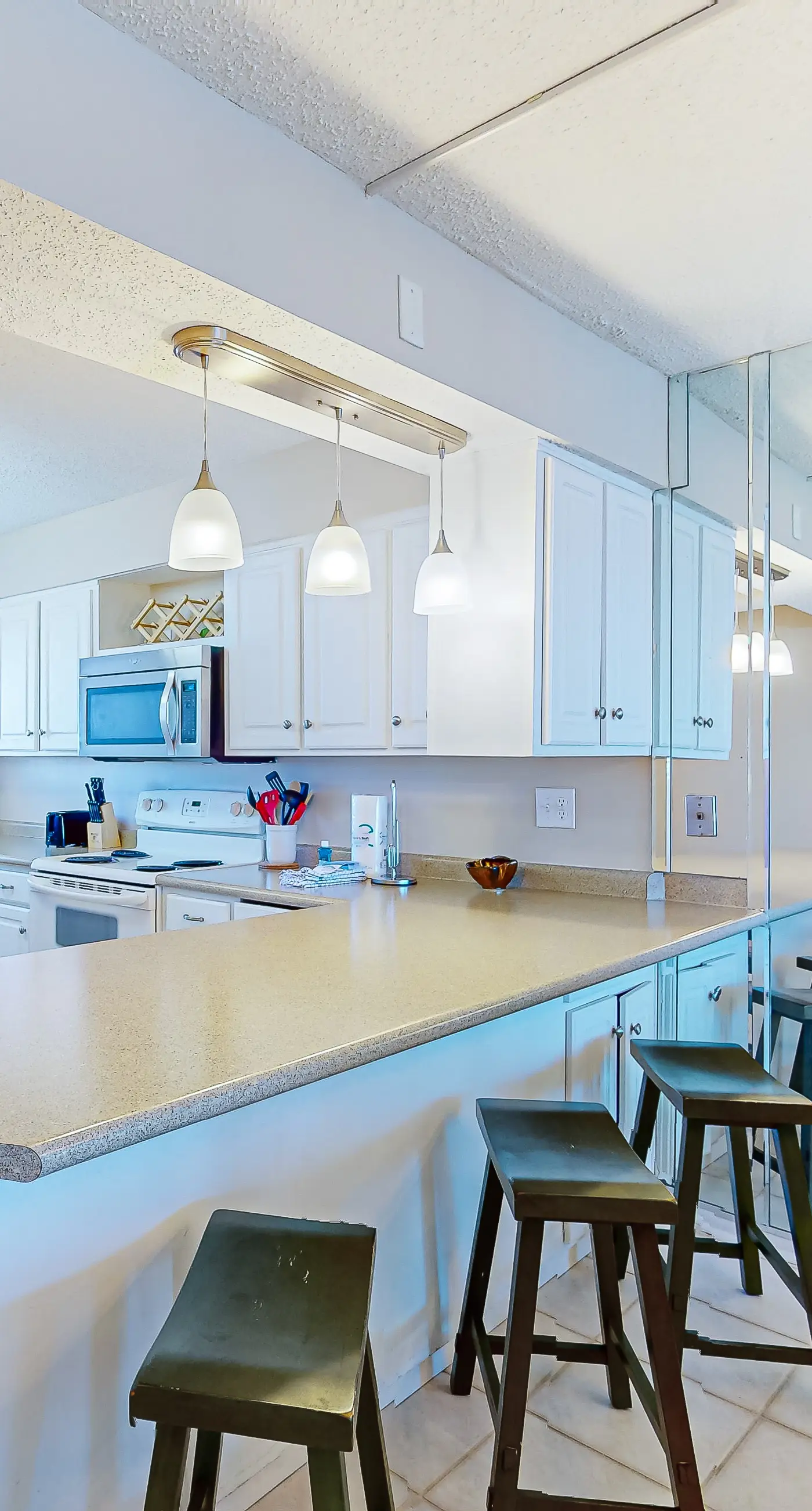 Stunning beachfront condo w/ beach access, shared pool, & private balcony