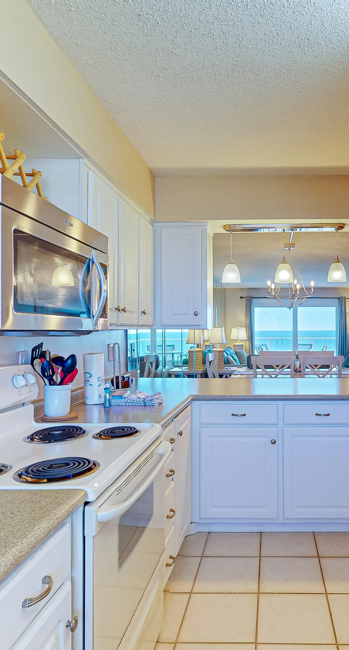 Stunning beachfront condo w/ beach access, shared pool, & private balcony