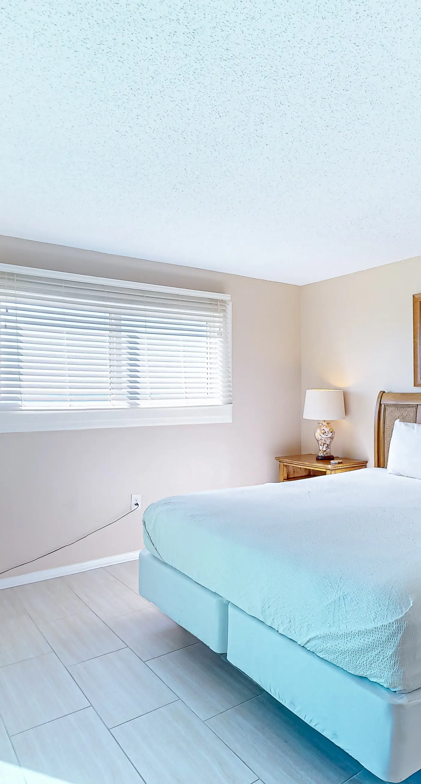 Stunning beachfront condo w/ beach access, shared pool, & private balcony