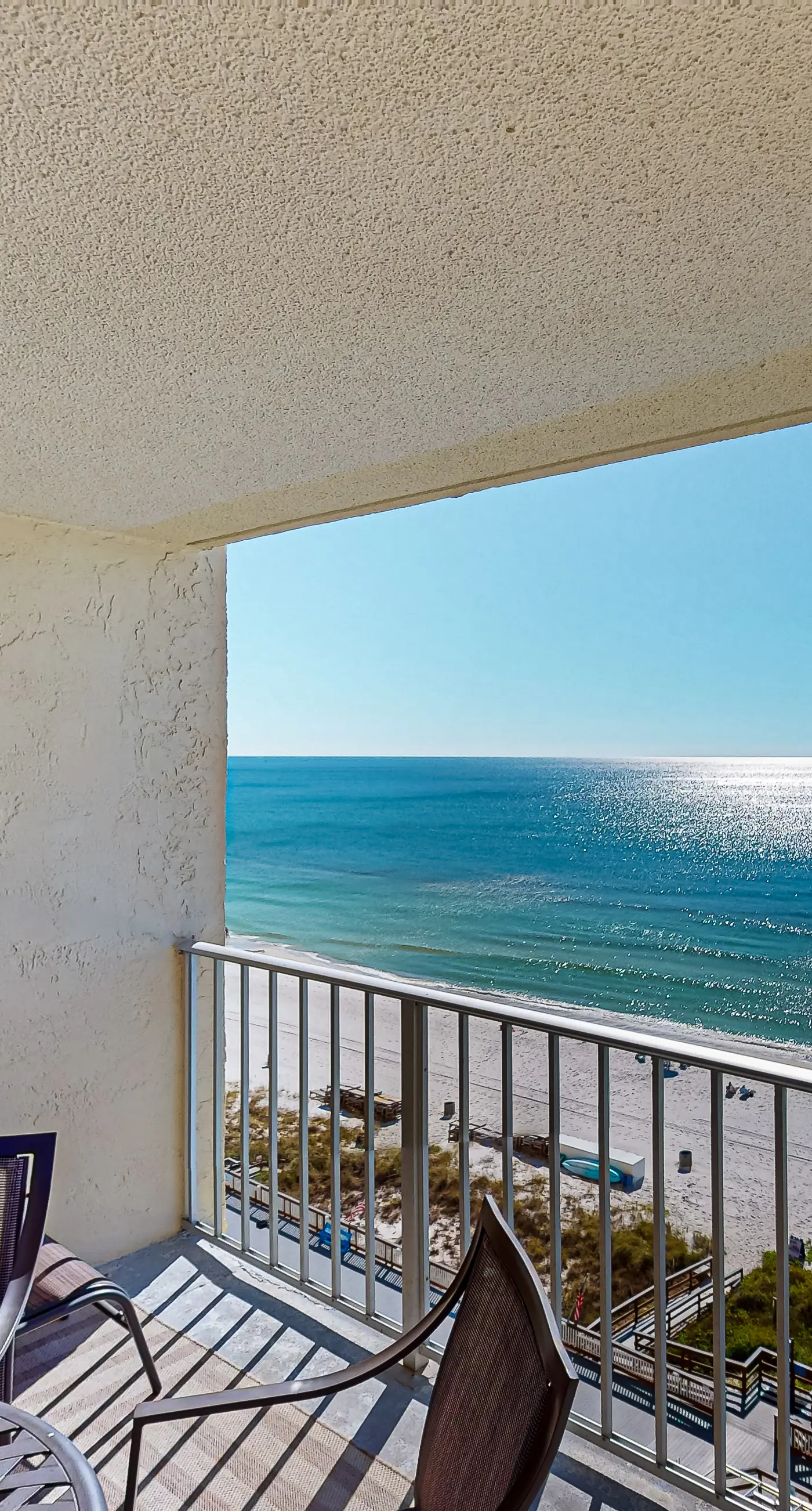 Stunning beachfront condo w/ beach access, shared pool, & private balcony