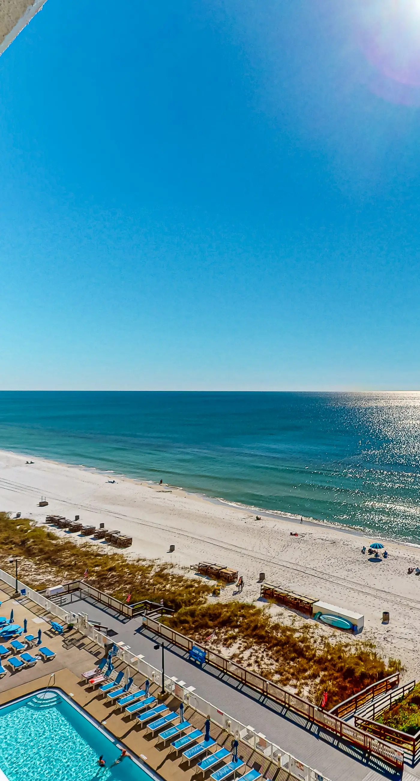 Stunning beachfront condo w/ beach access, shared pool, & private balcony