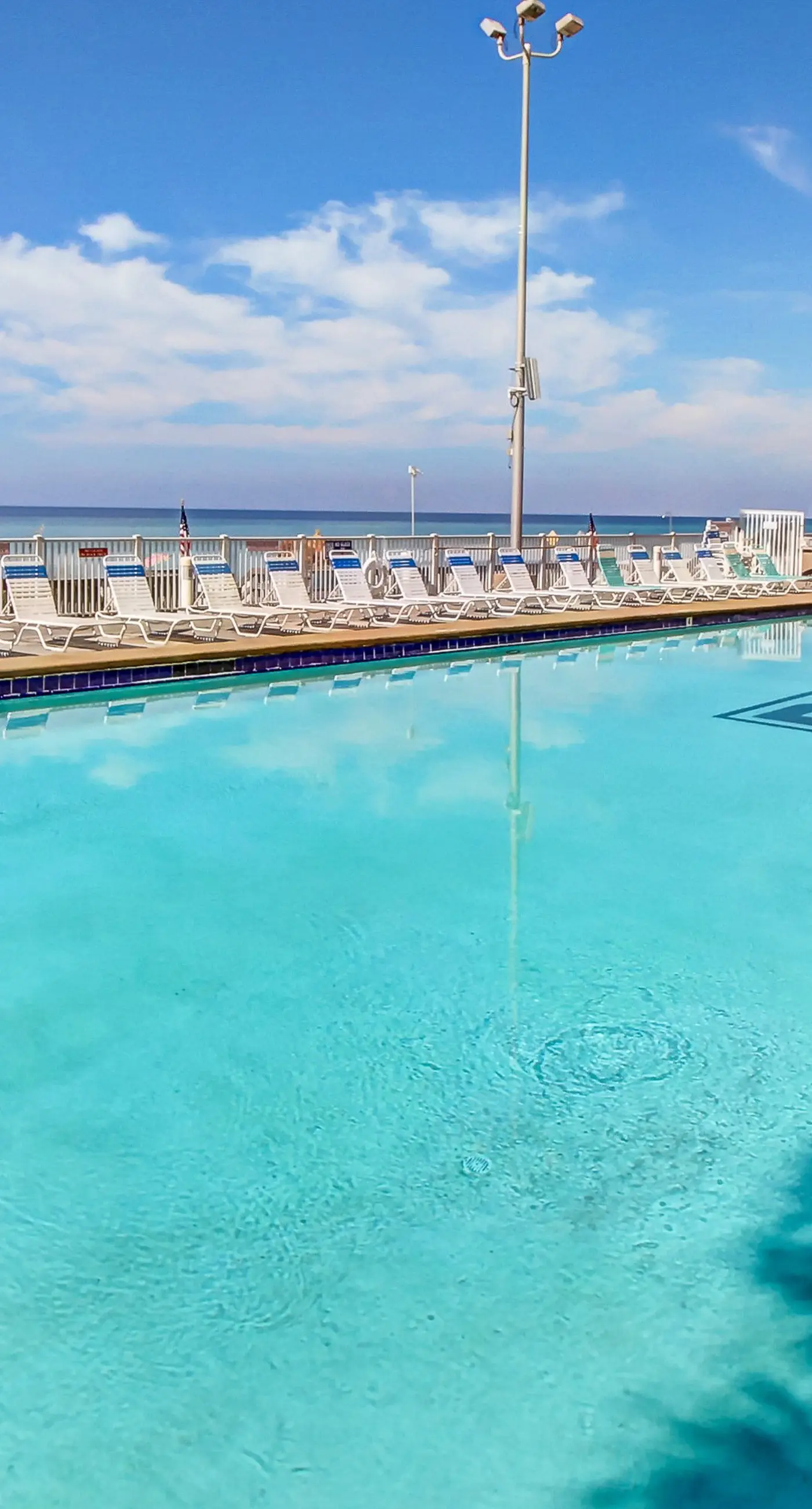 Stunning beachfront condo w/ beach access, shared pool, & private balcony