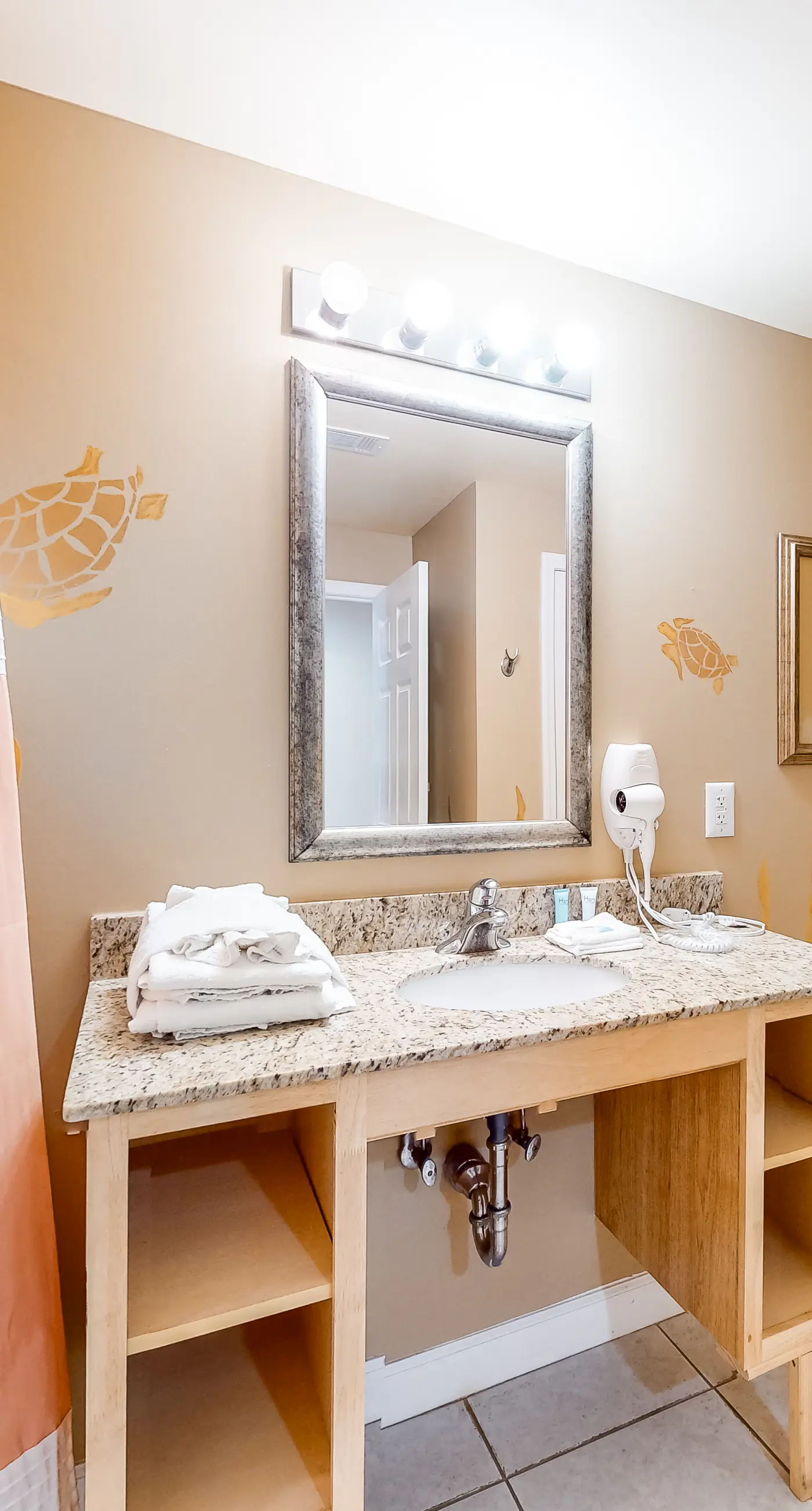 Superb beach living at lovely waterfront condo with pools, a gym, & hot tub