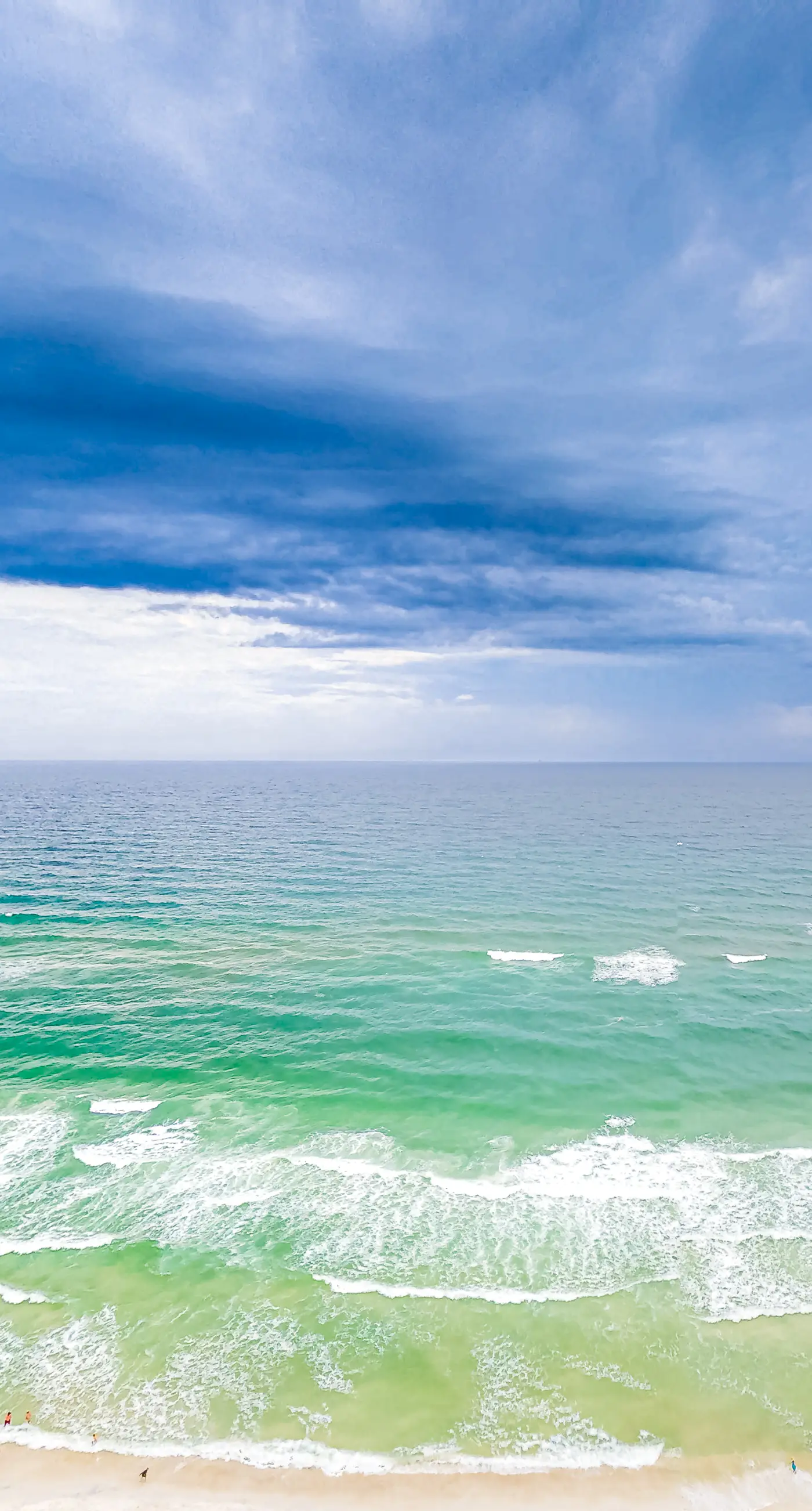 Superb beach living at lovely waterfront condo with pools, a gym, & hot tub