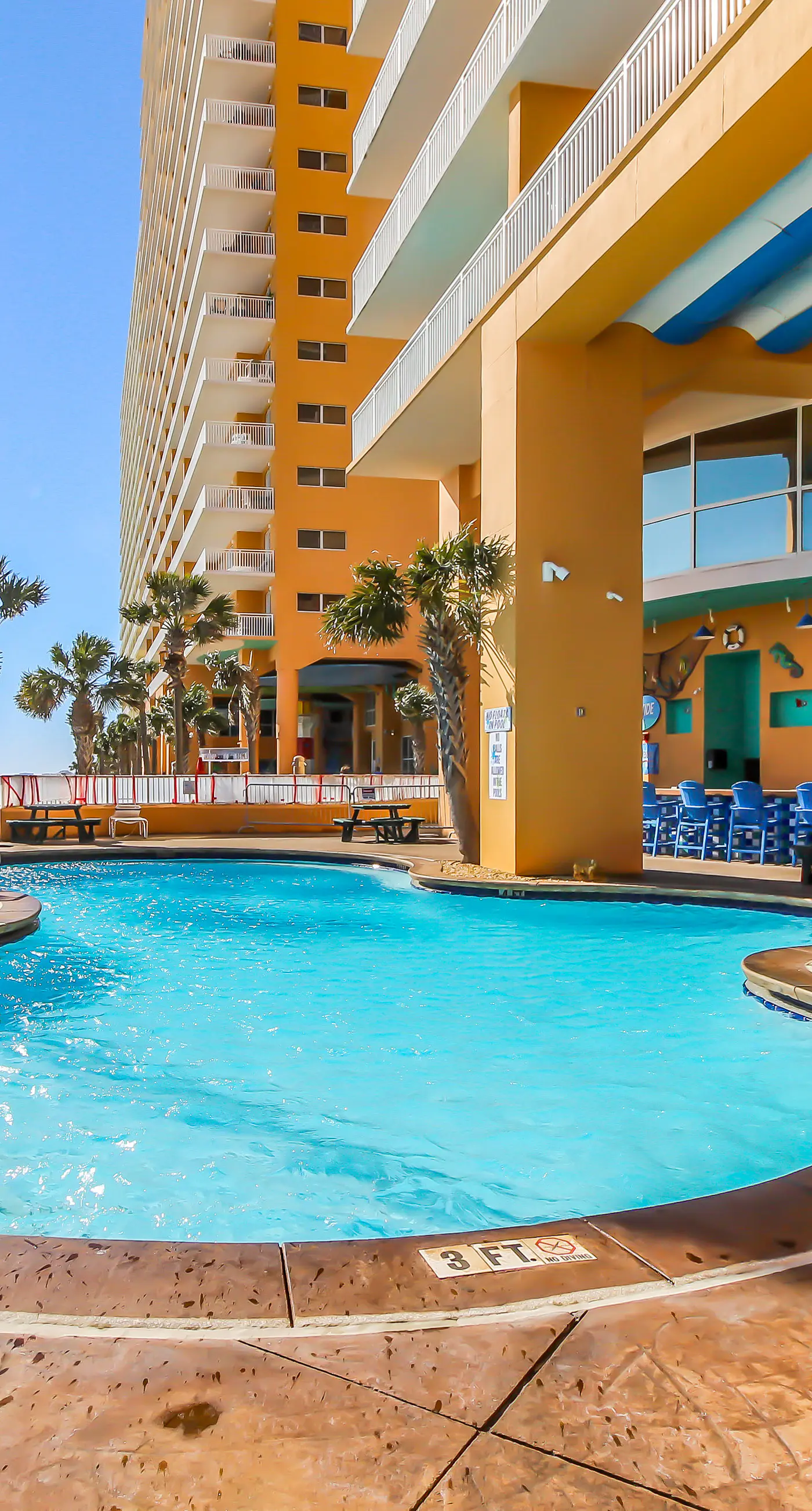 Superb beach living at lovely waterfront condo with pools, a gym, & hot tub